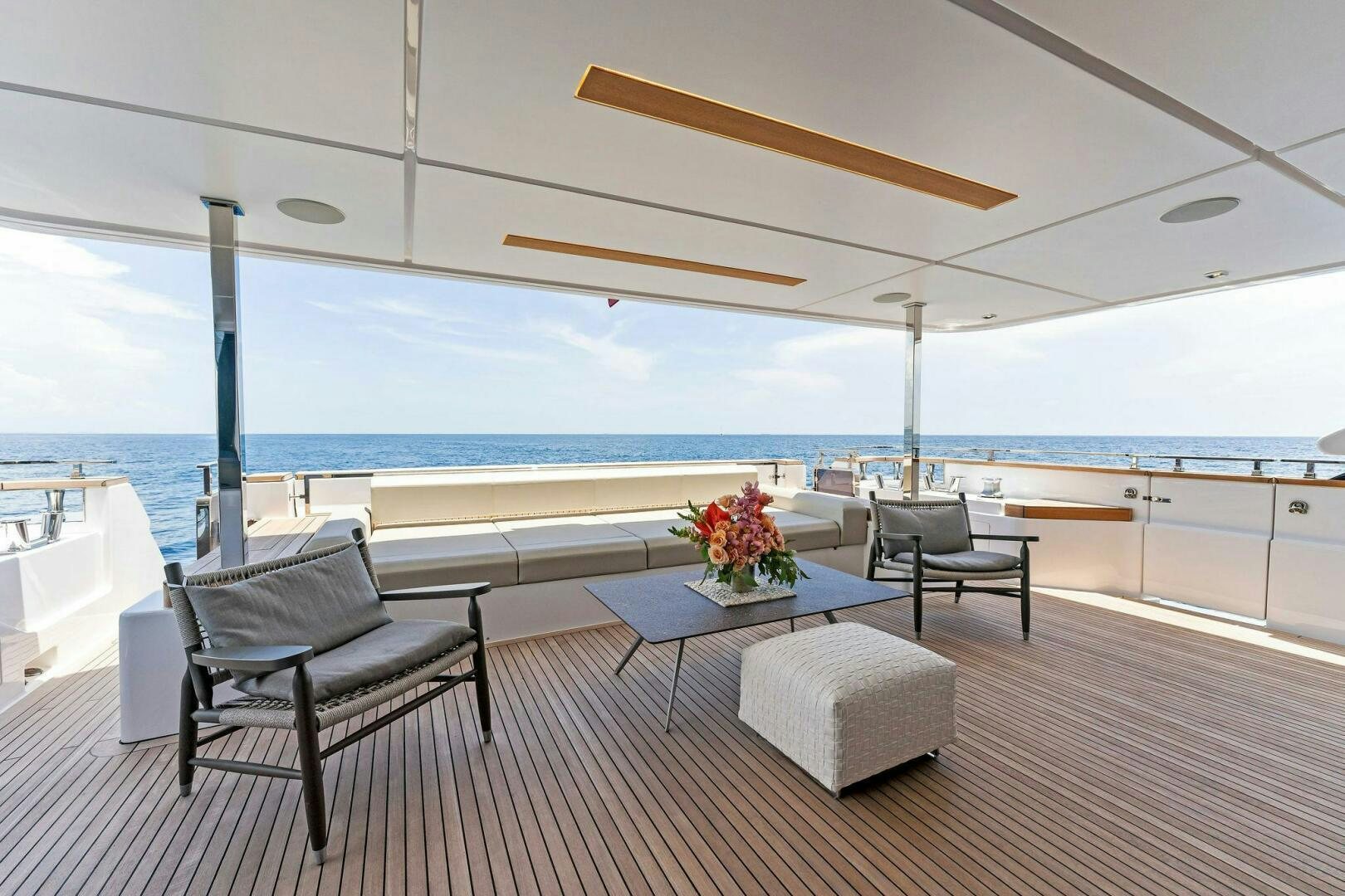 a room with a table and chairs aboard FAMILIA Yacht for Sale