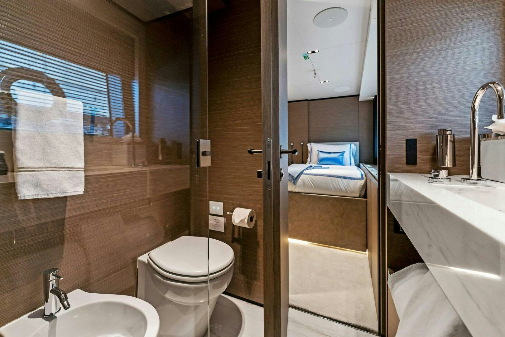 a bathroom with a sink toilet and bathtub aboard FAMILIA Yacht for Sale