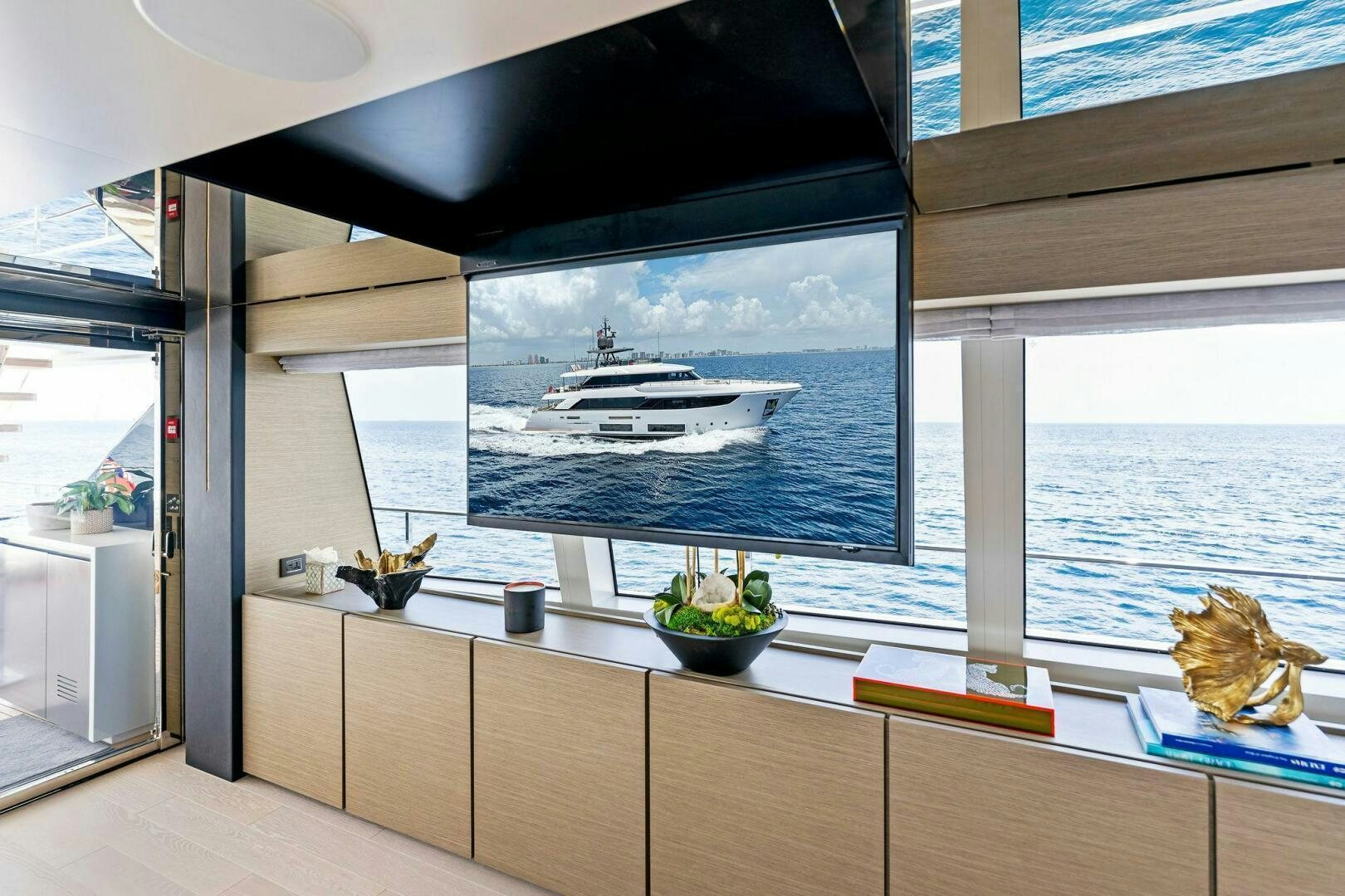 a room with a large window and a view of the water aboard FAMILIA Yacht for Sale