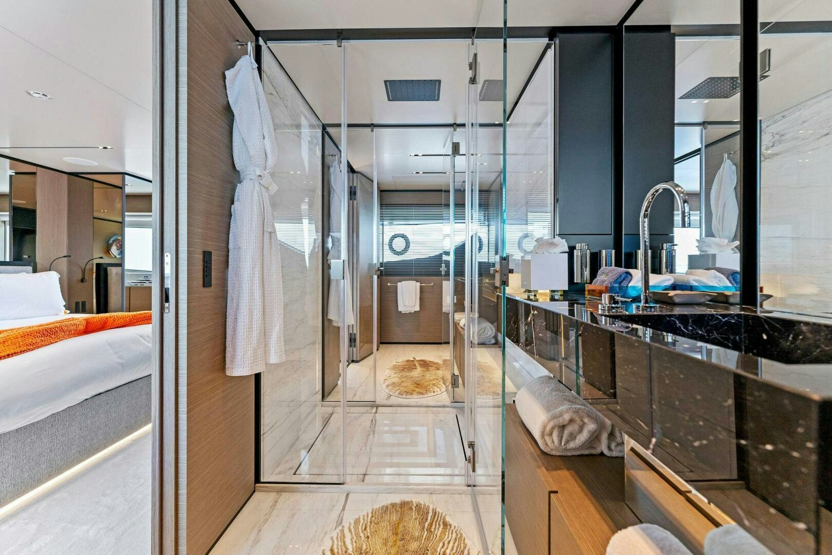 a bathroom with a glass shower aboard FAMILIA Yacht for Sale