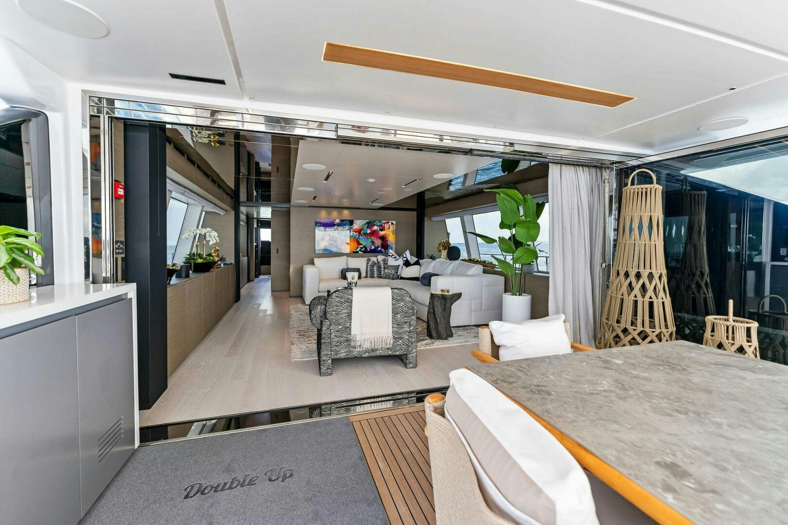 a room with a table and chairs aboard FAMILIA Yacht for Sale
