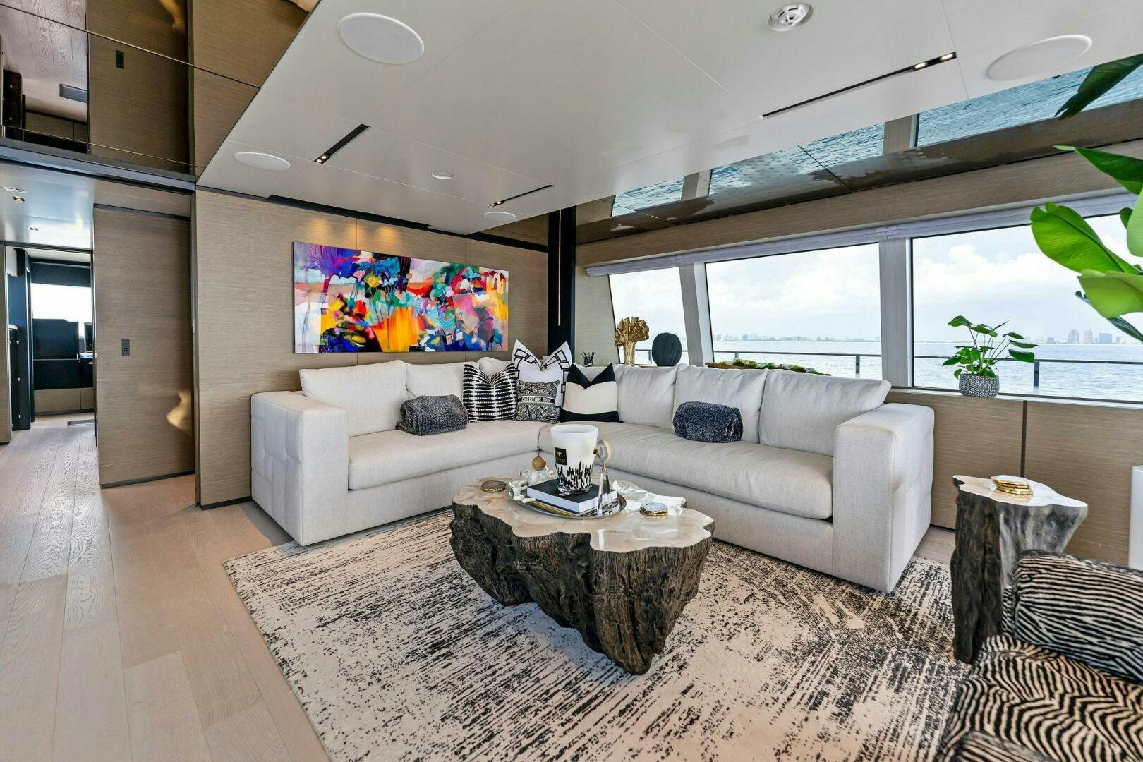 a living room with a large window aboard FAMILIA Yacht for Sale