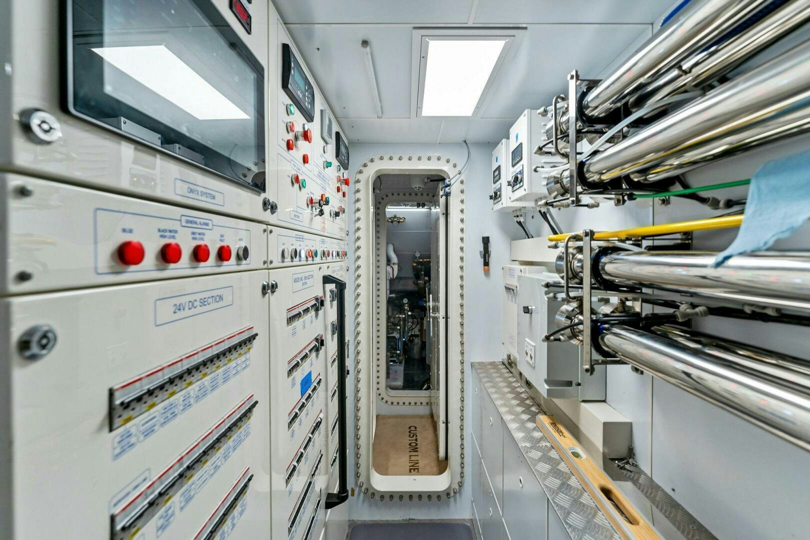 a room with white machines aboard FAMILIA Yacht for Sale