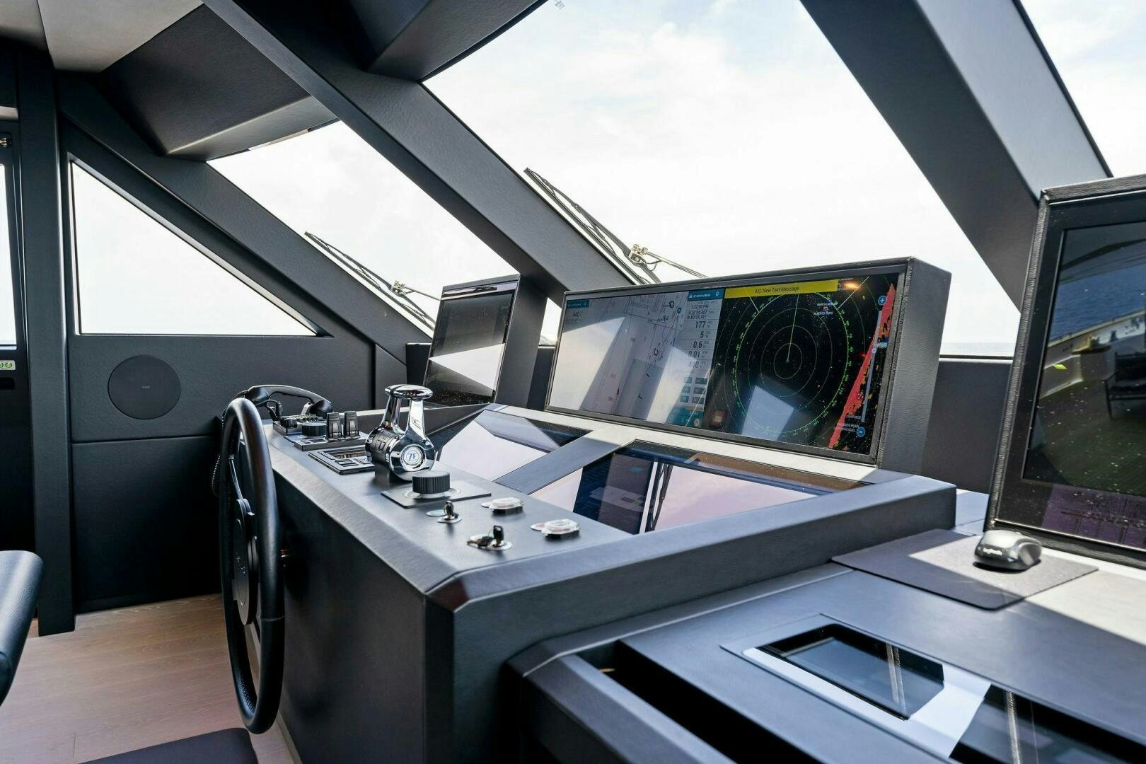 a desk with a computer and a monitor aboard FAMILIA Yacht for Sale