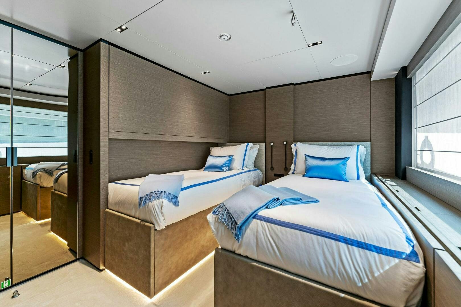 a room with two beds aboard FAMILIA Yacht for Sale