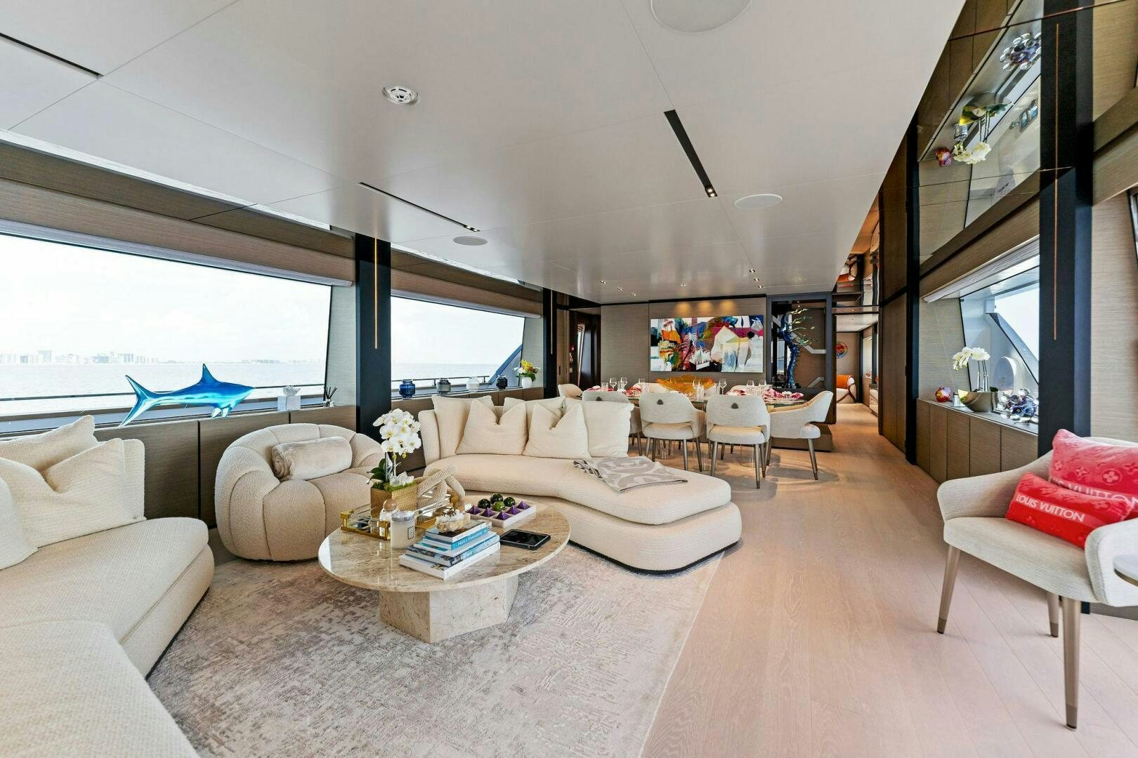 a living room with a large window aboard FAMILIA Yacht for Sale