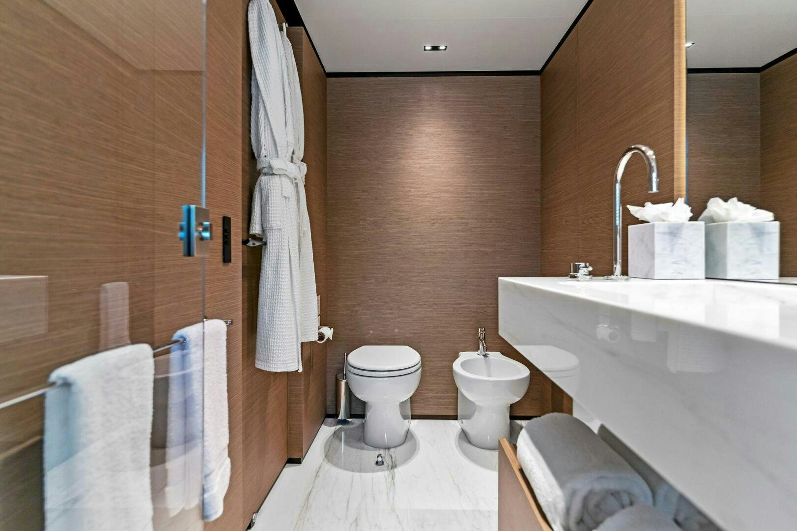 a bathroom with a sink toilet and bathtub aboard FAMILIA Yacht for Sale