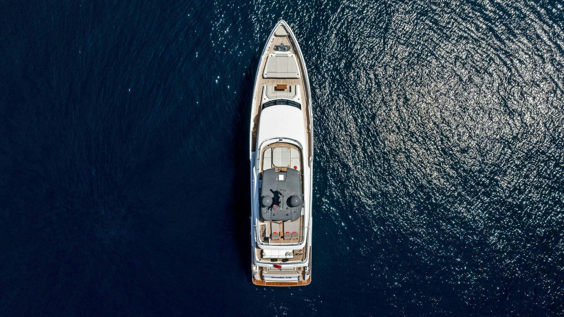 a white and gold boat aboard FAMILIA Yacht for Sale
