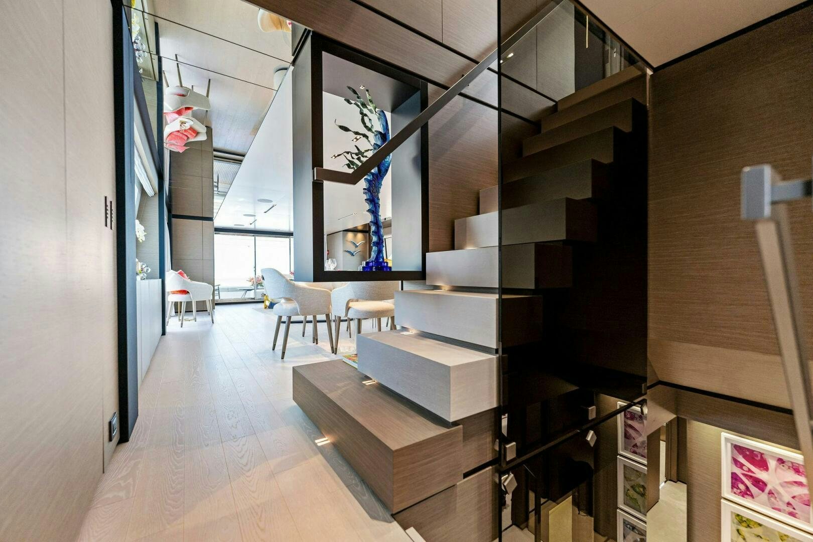 a room with shelves and books aboard FAMILIA Yacht for Sale