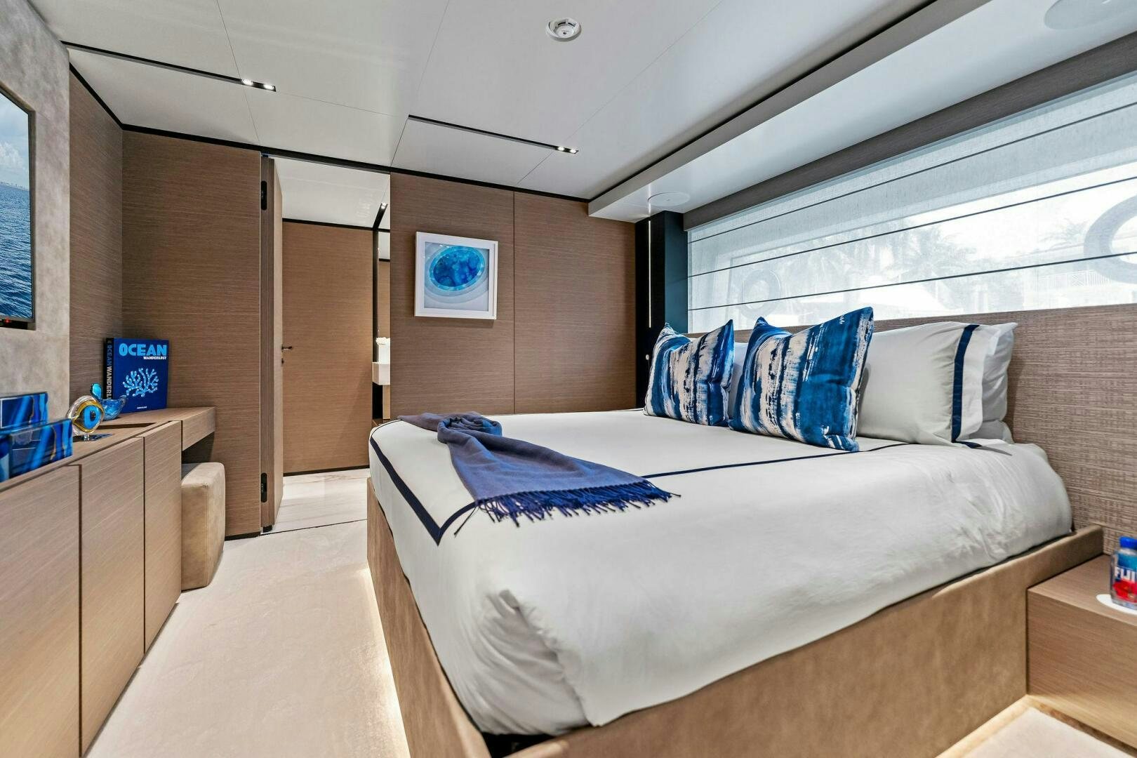 a bedroom with a bed aboard FAMILIA Yacht for Sale