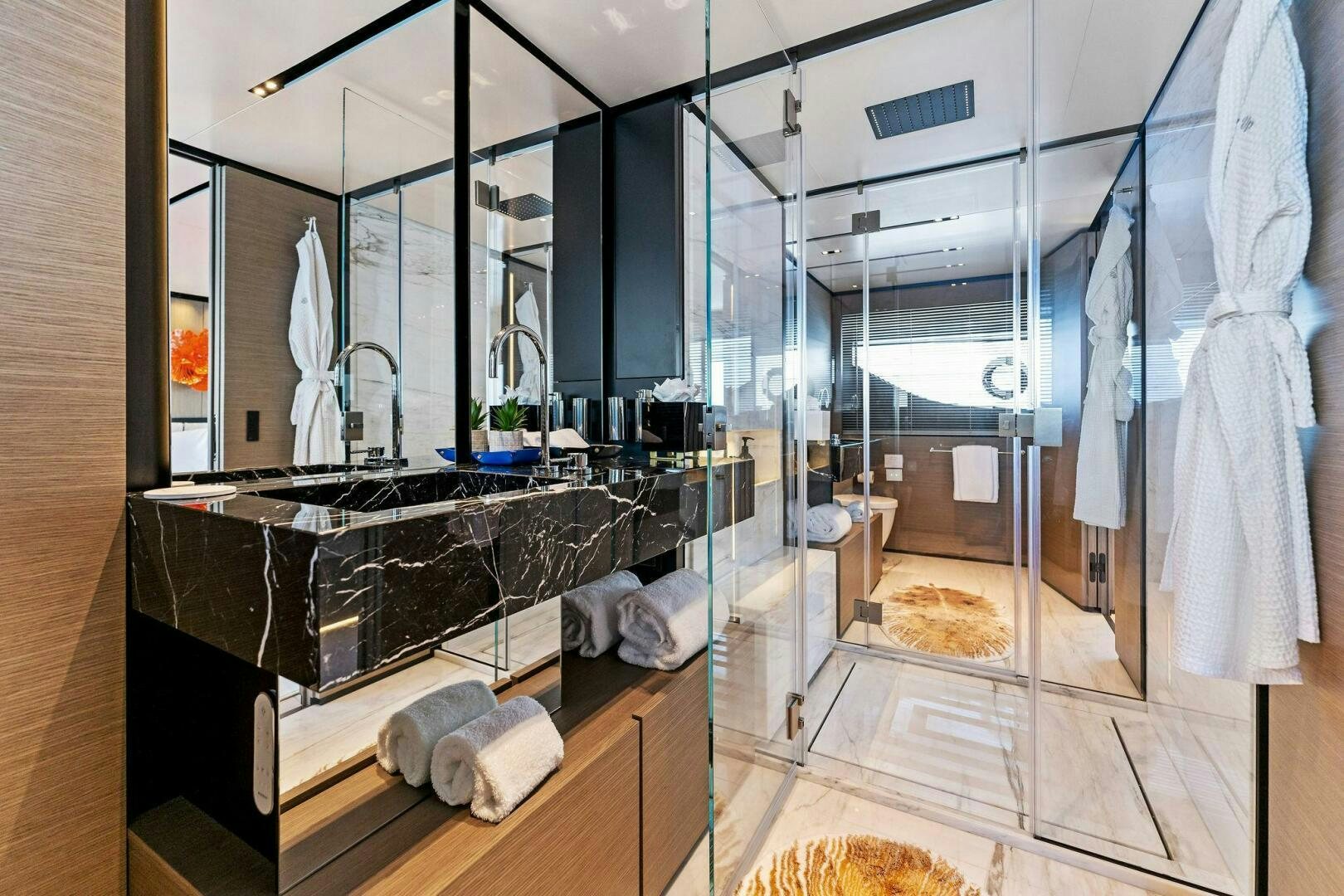 a bathroom with a large glass shower aboard FAMILIA Yacht for Sale