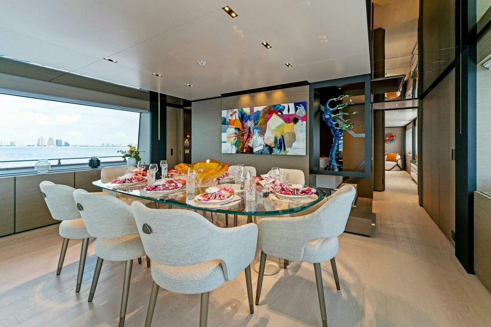 a dining room with a table and chairs aboard FAMILIA Yacht for Sale