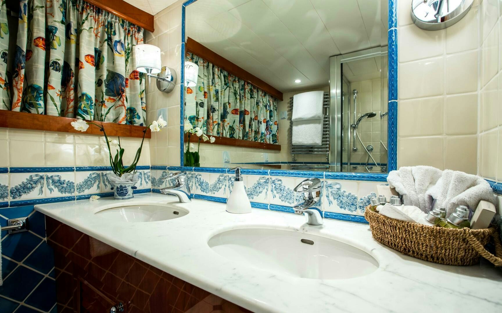 a bathroom with a large mirror aboard STAR OF THE SEA Yacht for Sale