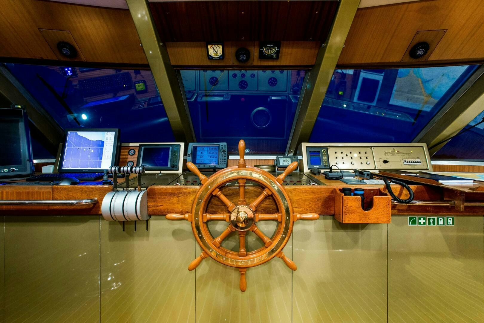 a wooden wheel on a wooden table aboard STAR OF THE SEA Yacht for Sale