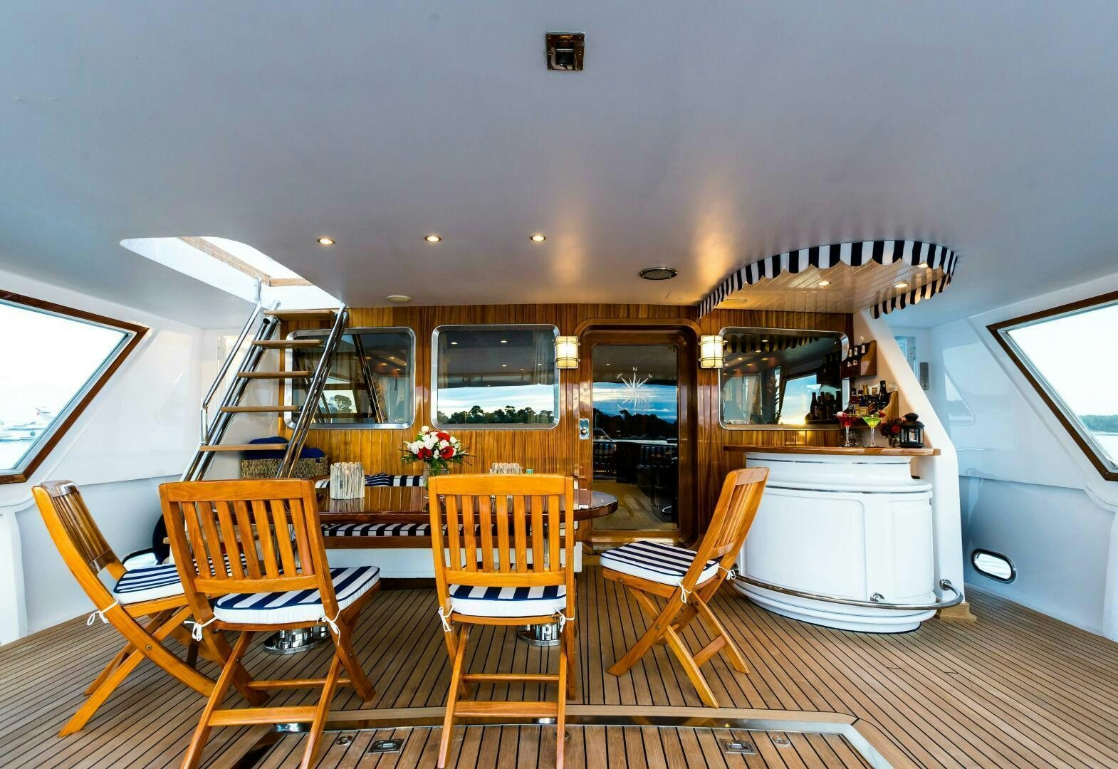 a room with wooden furniture aboard STAR OF THE SEA Yacht for Sale
