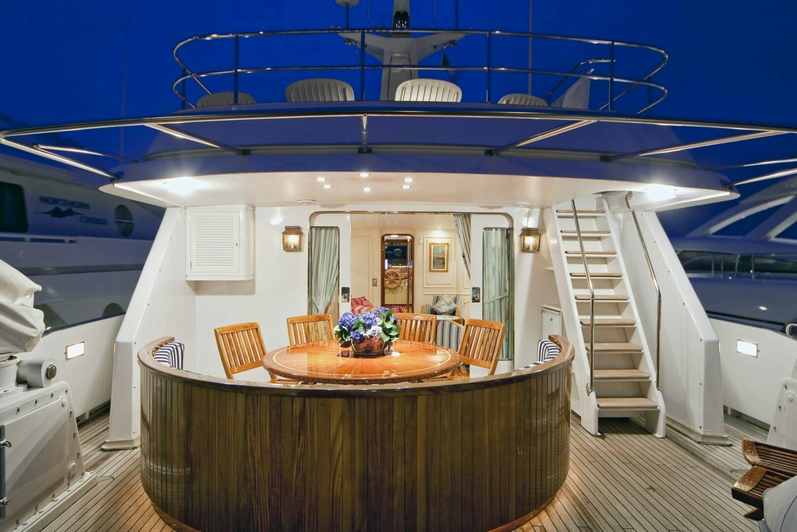 a kitchen with a table and chairs aboard STAR OF THE SEA Yacht for Sale