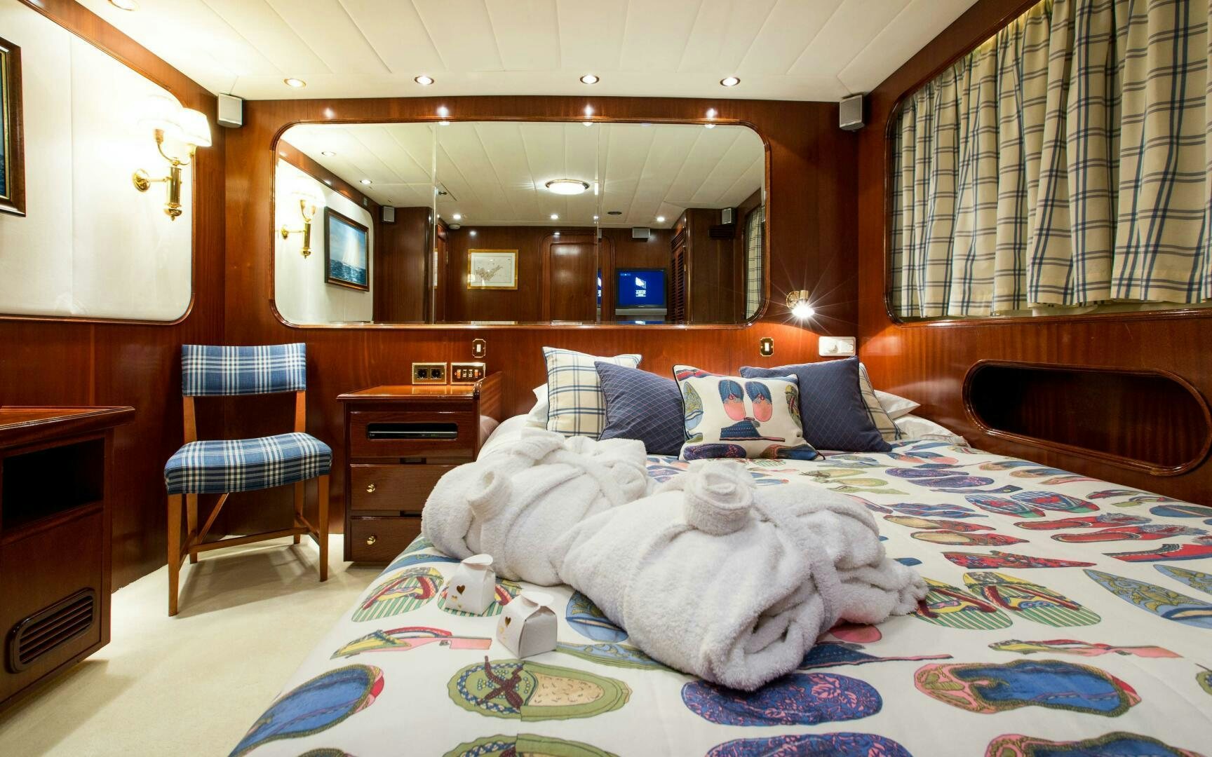 a bed with a blanket on it aboard STAR OF THE SEA Yacht for Sale