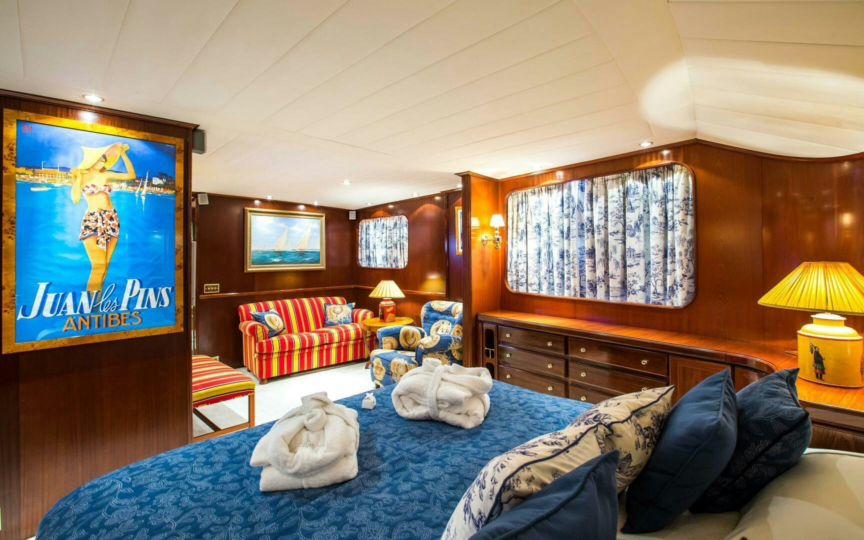 a bedroom with a bed and a desk aboard STAR OF THE SEA Yacht for Sale