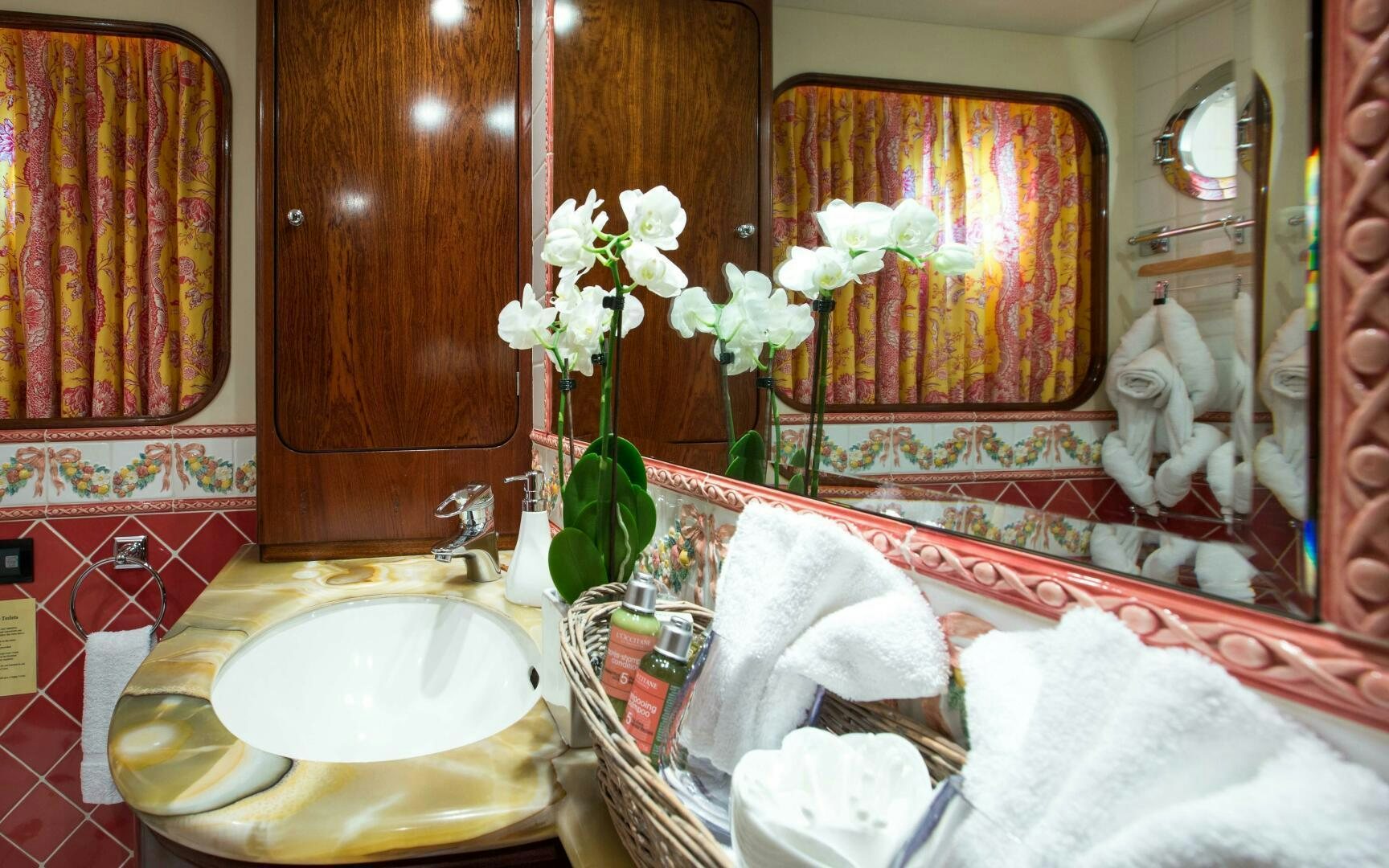 a bathroom with a sink and towels aboard STAR OF THE SEA Yacht for Sale