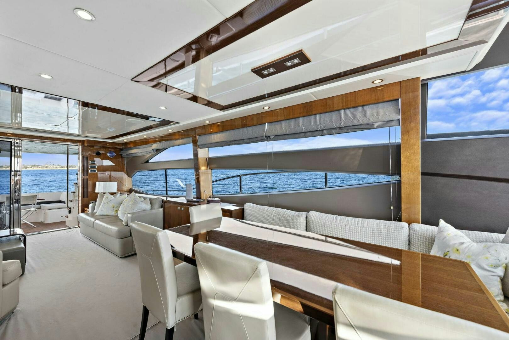 a room with couches and a view of the ocean aboard LA-Z-BUOY Yacht for Sale