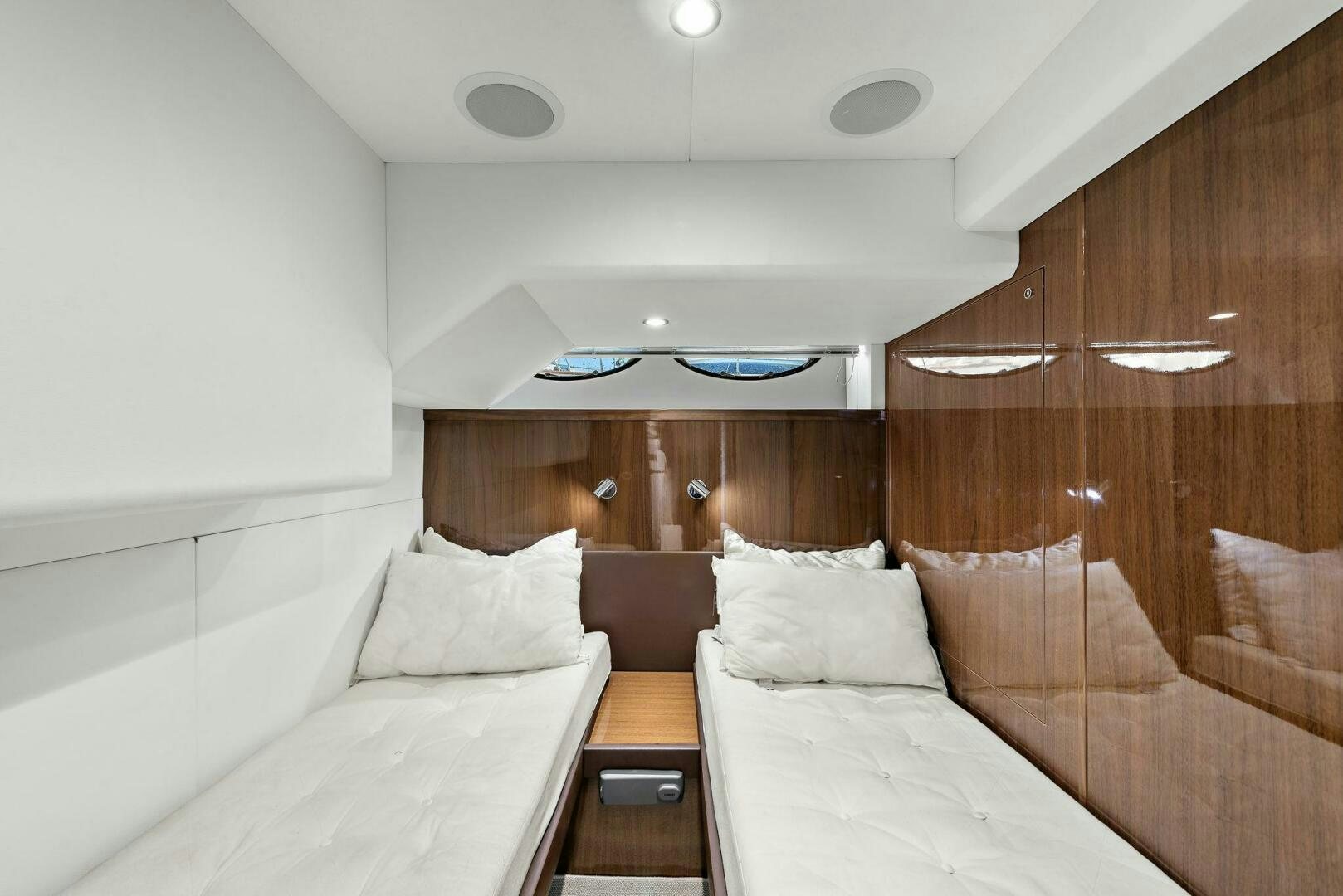 a room with a bed and a table aboard LA-Z-BUOY Yacht for Sale