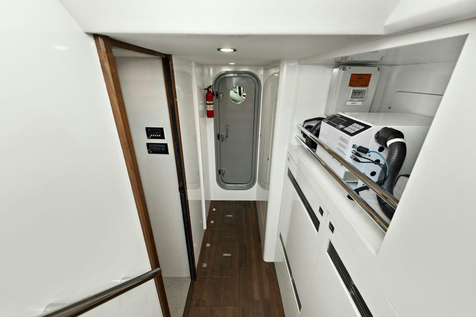 a hallway with white cabinets aboard LA-Z-BUOY Yacht for Sale