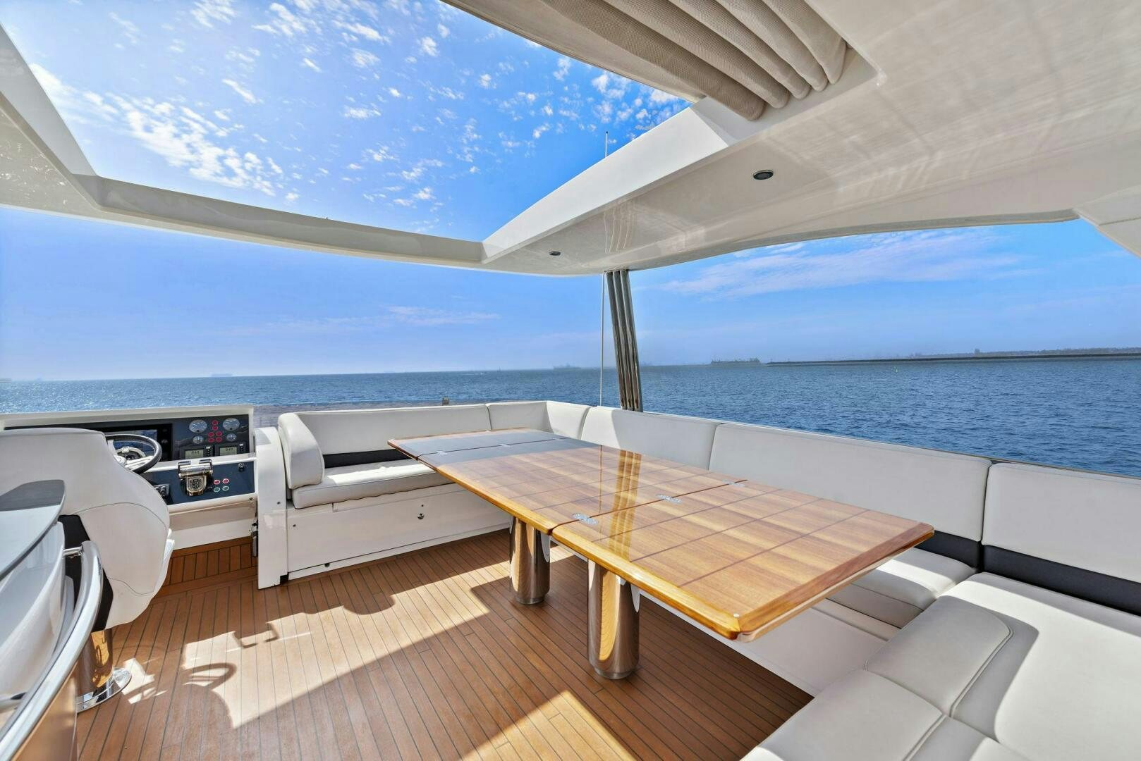 a room with a table and chairs aboard LA-Z-BUOY Yacht for Sale
