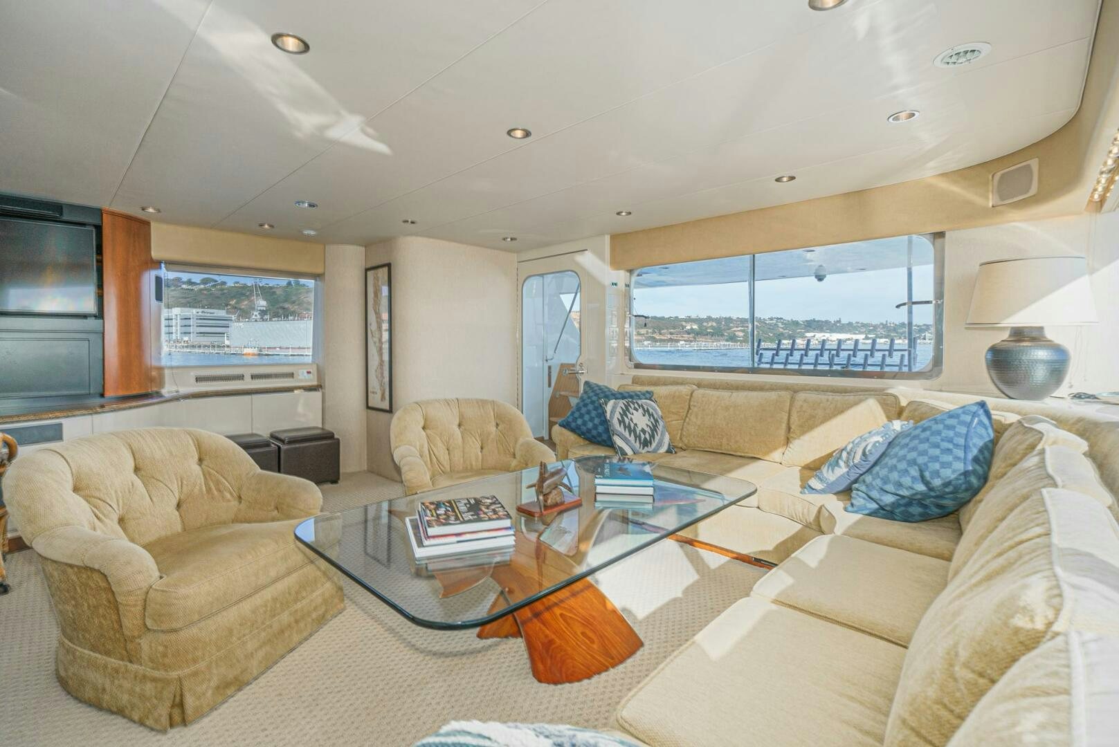 a living room with a large window aboard AQUILA Yacht for Sale