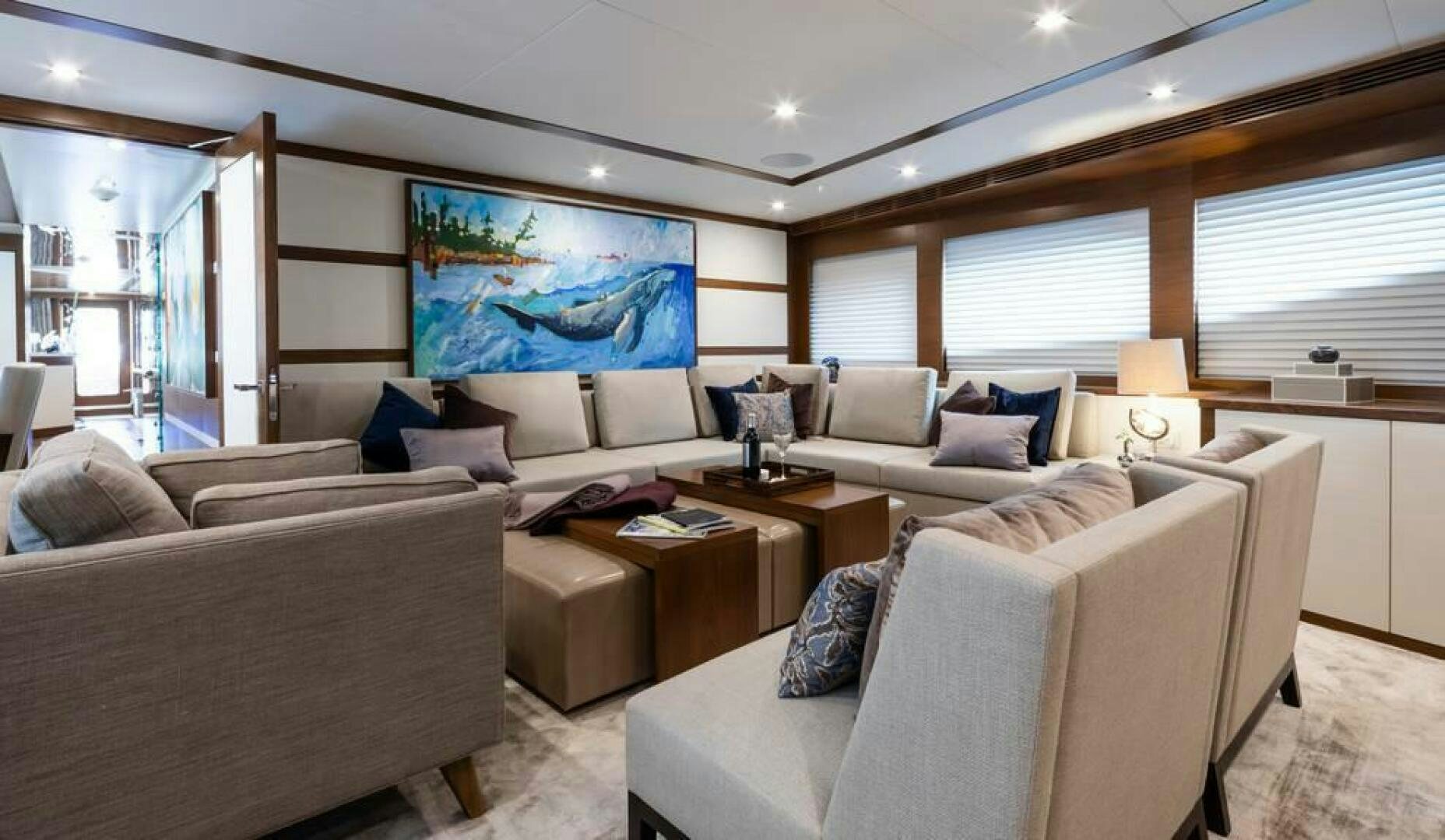 a living room with a couch and a tv aboard NORTHLAND Yacht for Sale