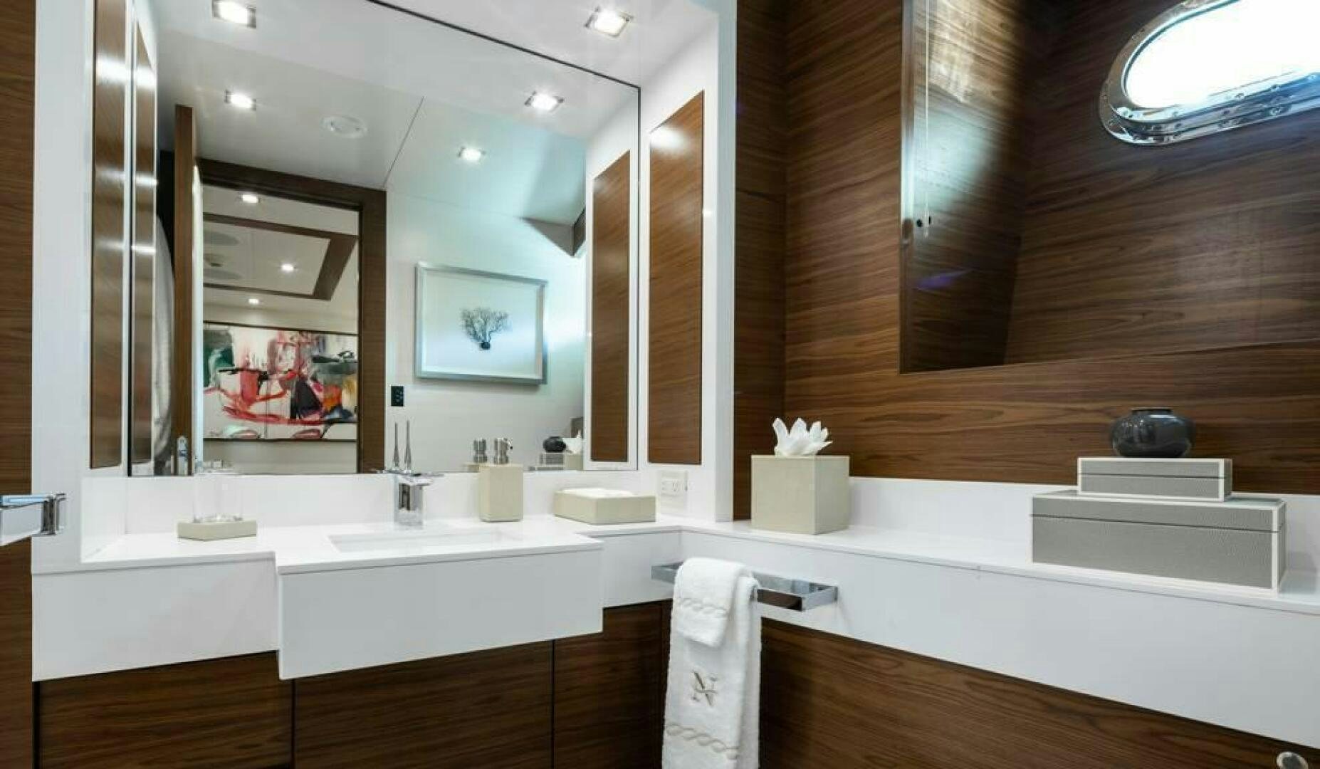 a bathroom with a large mirror aboard NORTHLAND Yacht for Sale