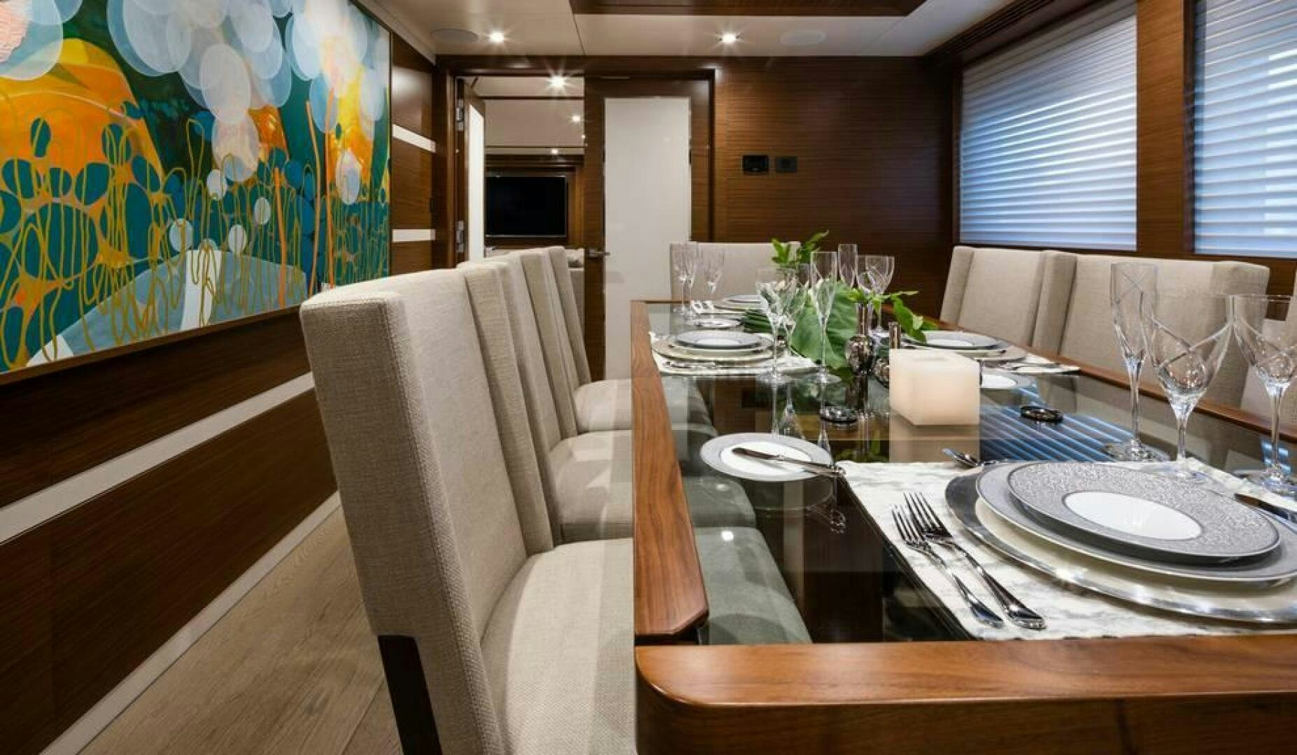 a table with plates and glasses aboard NORTHLAND Yacht for Sale