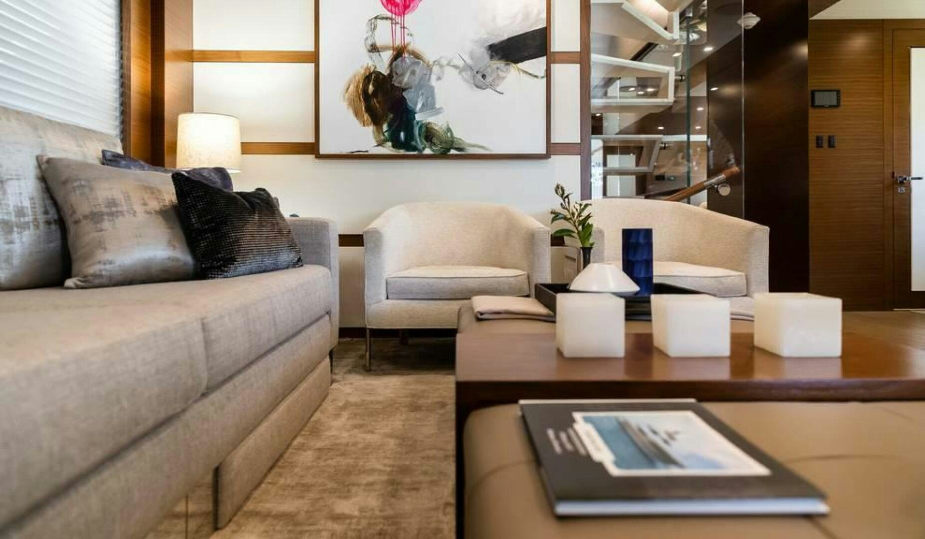 a living room with a couch and coffee table aboard NORTHLAND Yacht for Sale