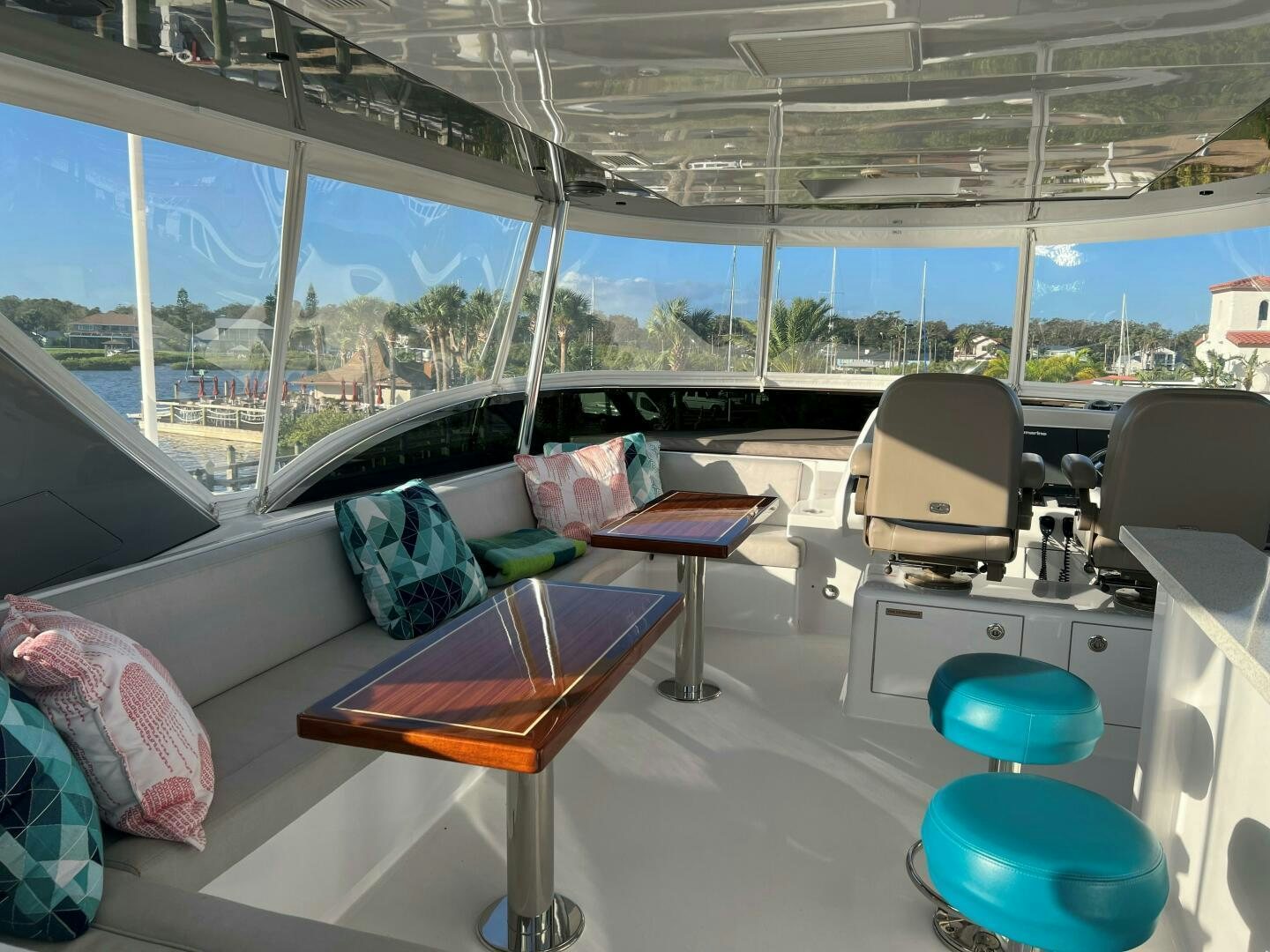 a room with a couch and a table and chairs aboard HAPPY HEART Yacht for Sale