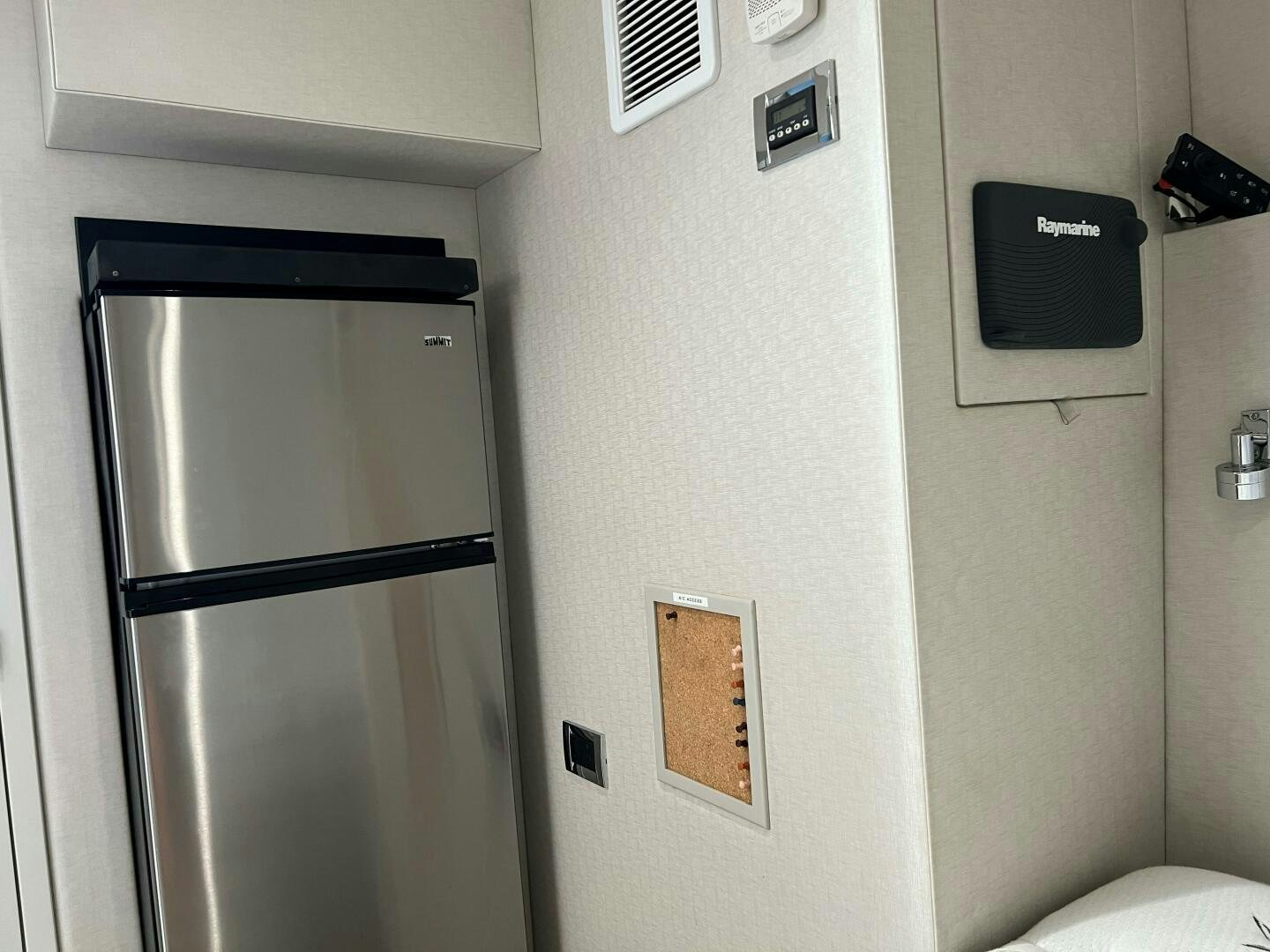 a refrigerator in a room aboard HAPPY HEART Yacht for Sale