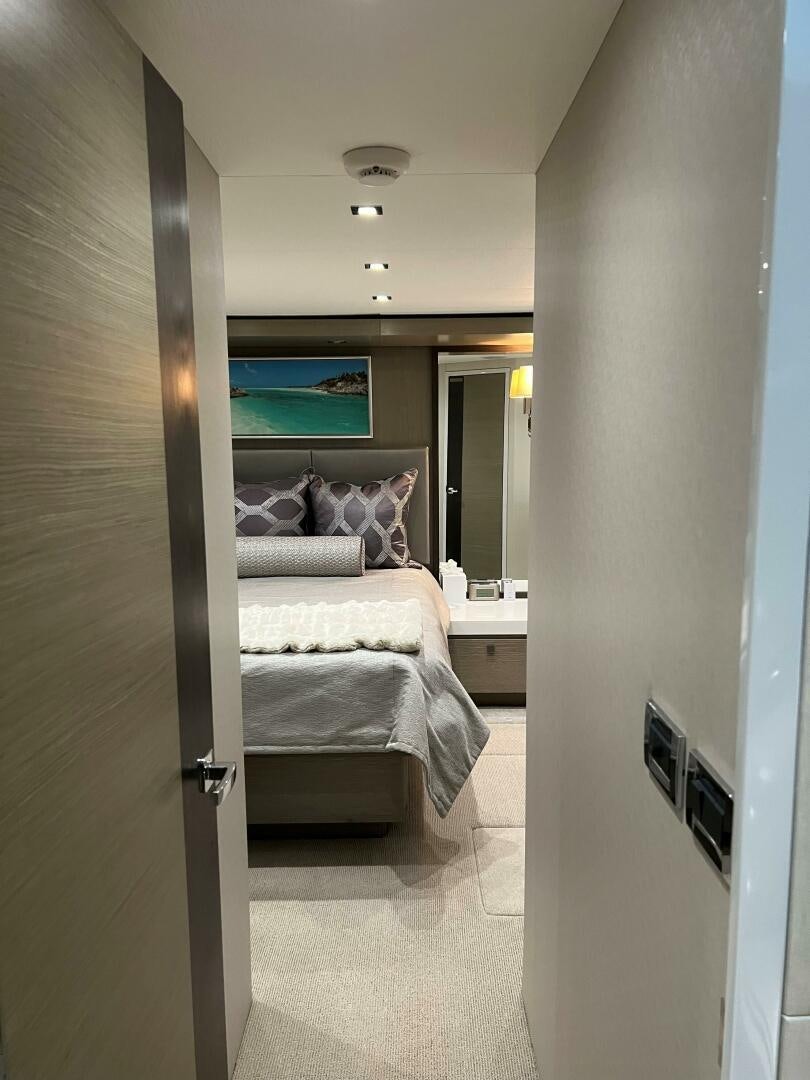 a bedroom with a bed aboard HAPPY HEART Yacht for Sale