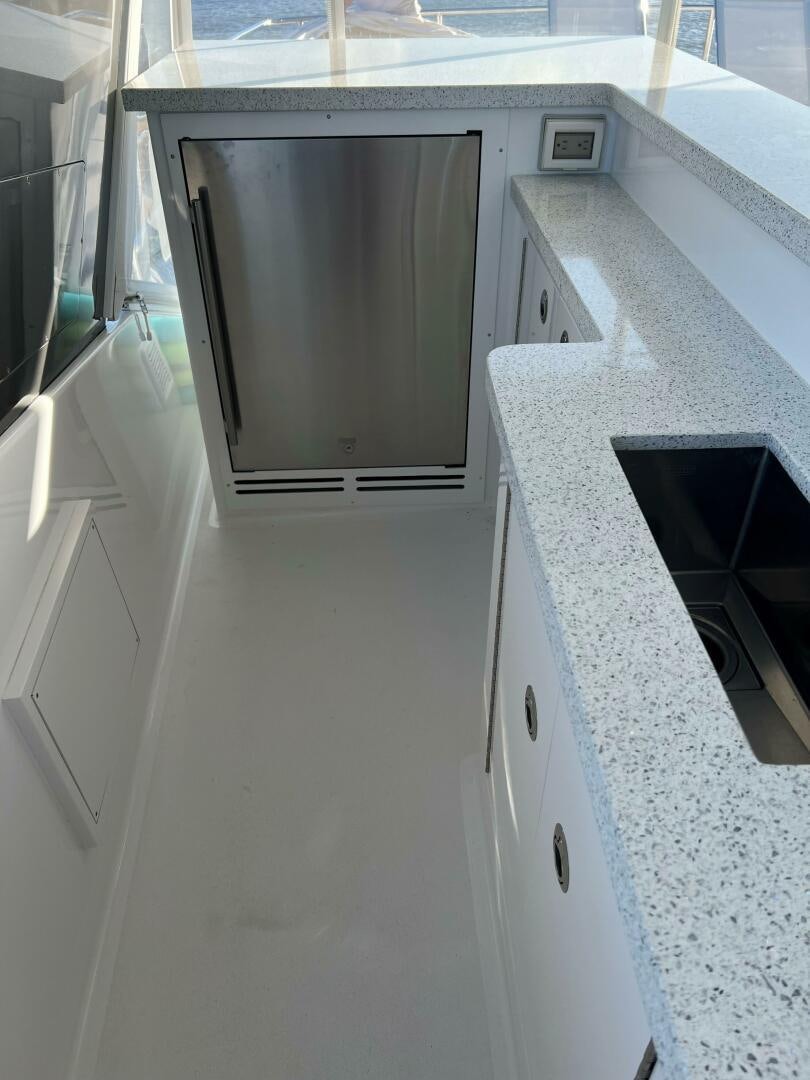 a kitchen with a microwave aboard HAPPY HEART Yacht for Sale