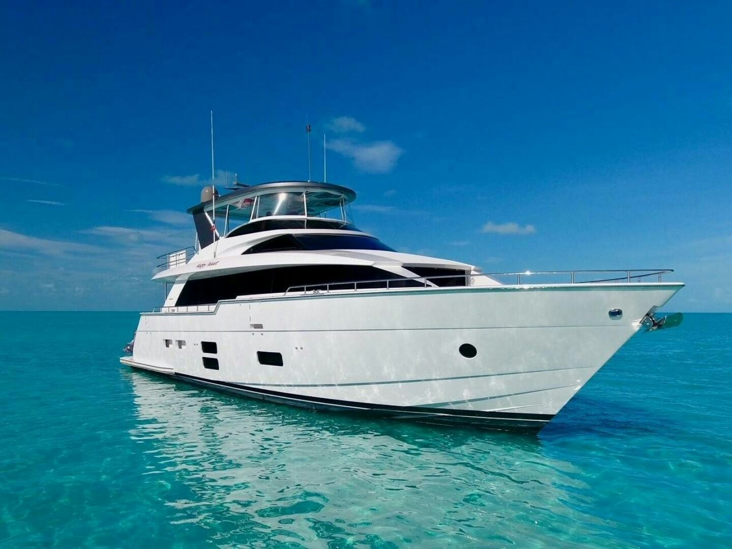 a white yacht in the water aboard HAPPY HEART Yacht for Sale