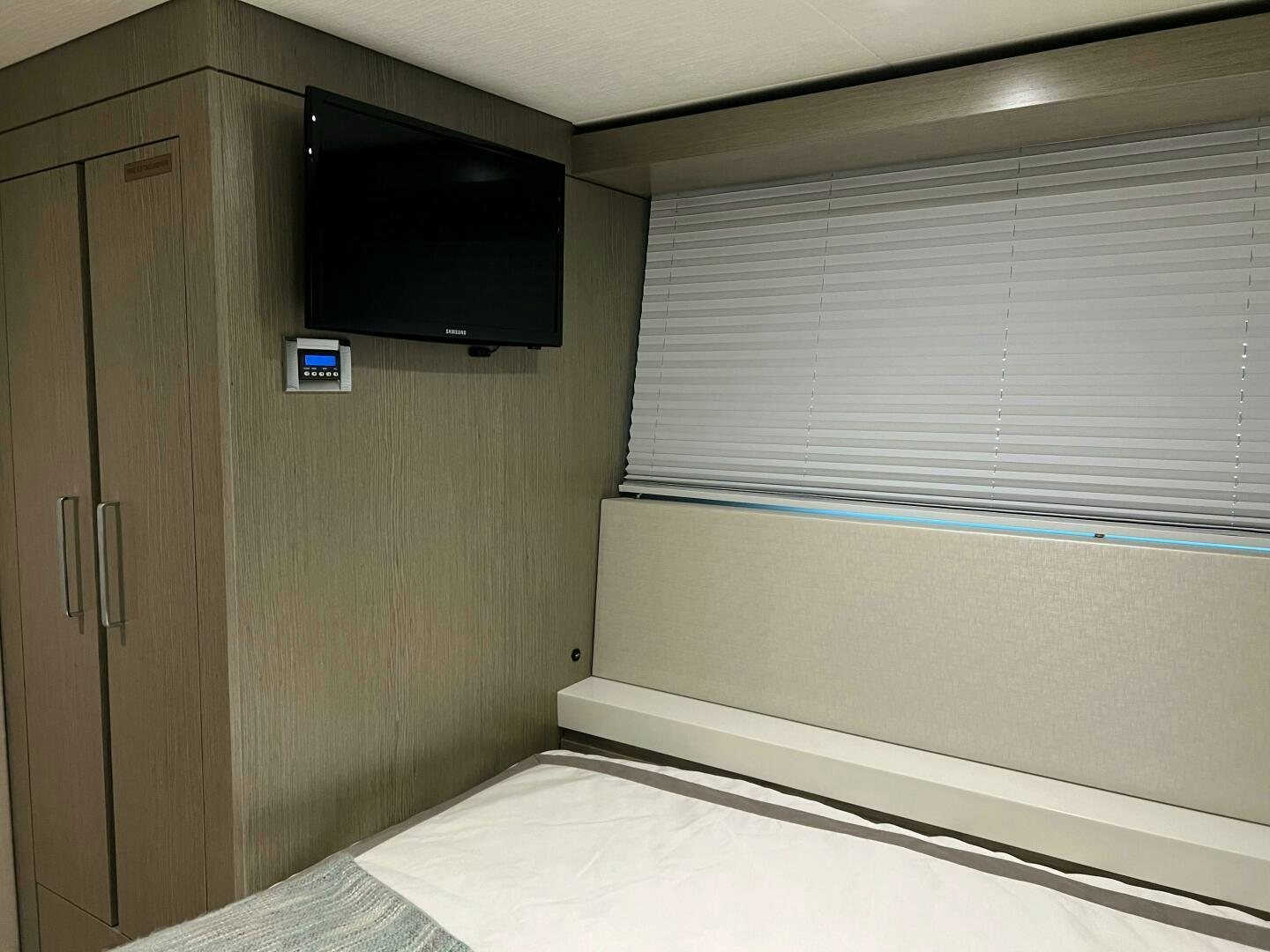a tv on a wall aboard HAPPY HEART Yacht for Sale