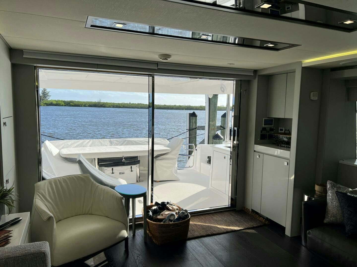 a room with a table and chairs aboard HAPPY HEART Yacht for Sale