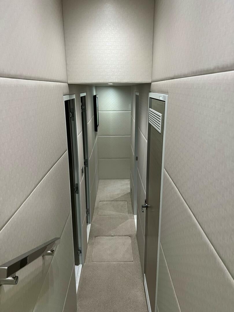 a hallway with a tile floor aboard HAPPY HEART Yacht for Sale