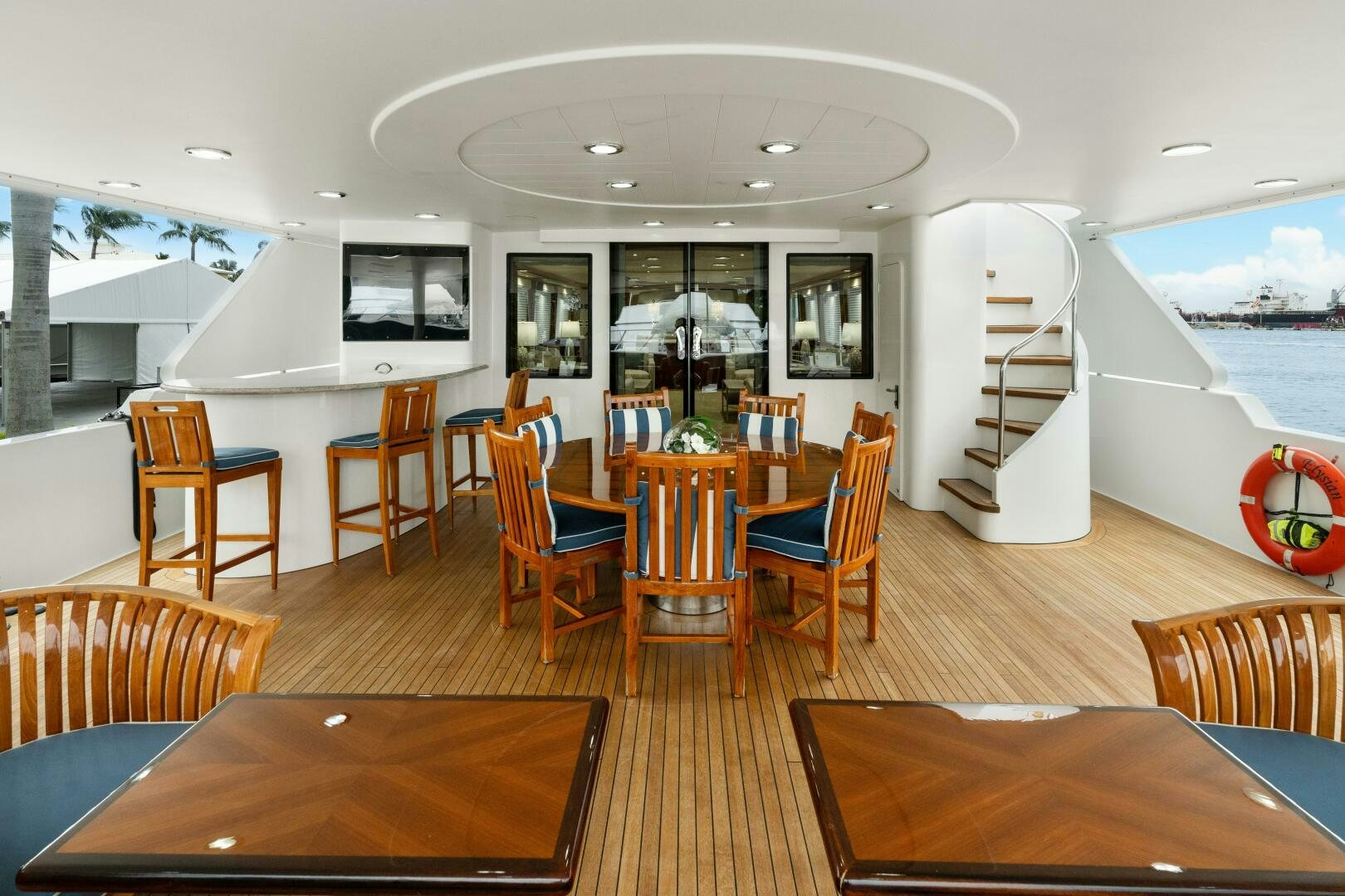 a large room with chairs and tables aboard ELYSIAN Yacht for Sale