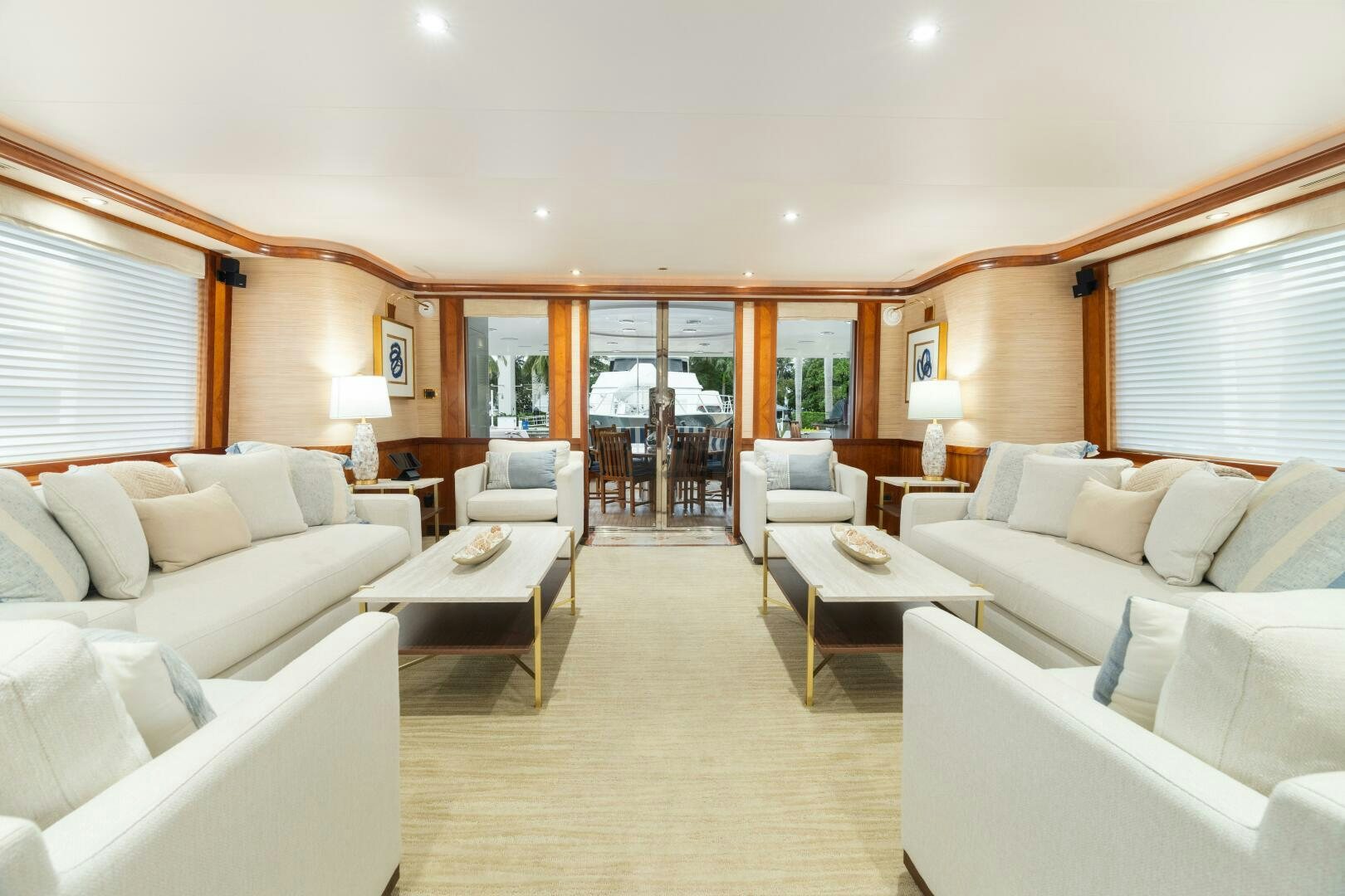 a living room with a dining table aboard ELYSIAN Yacht for Sale