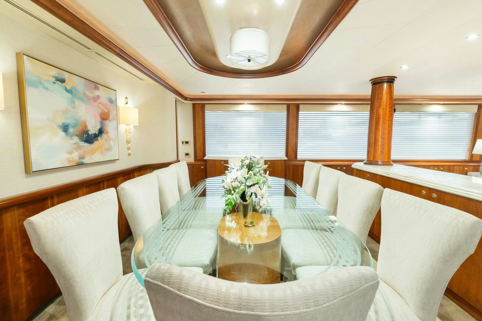 a room with a table and chairs aboard ELYSIAN Yacht for Sale