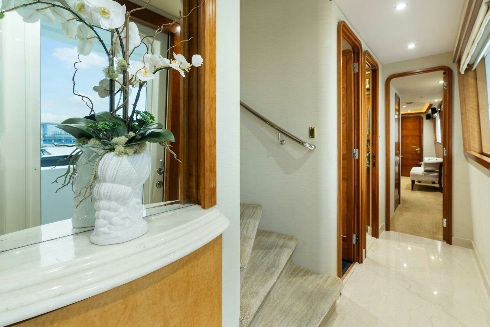 a vase of flowers sits on a counter in a bathroom aboard ELYSIAN Yacht for Sale