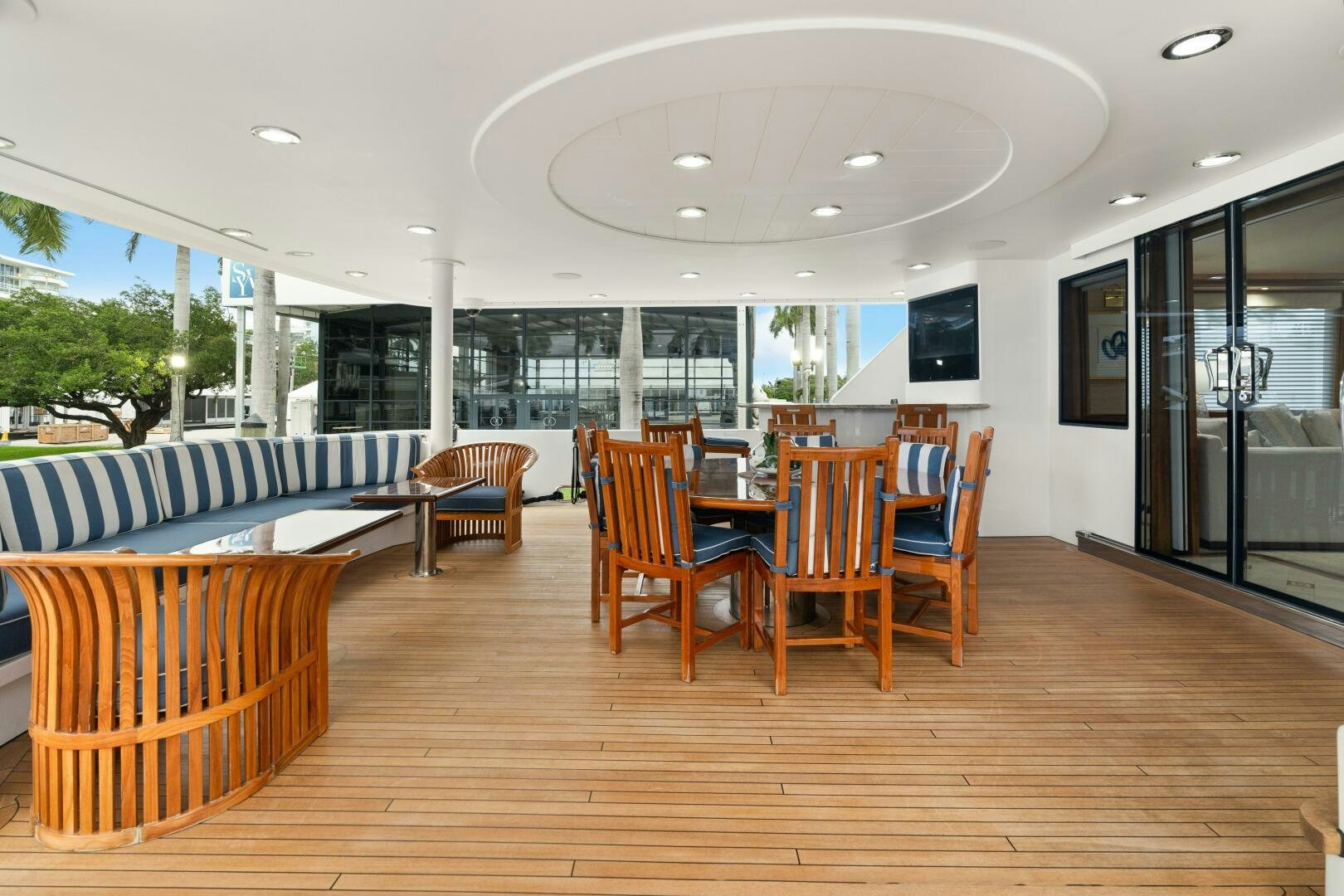 a room with wooden floors and a wood floor and a large window with a wood floor and wood aboard ELYSIAN Yacht for Sale