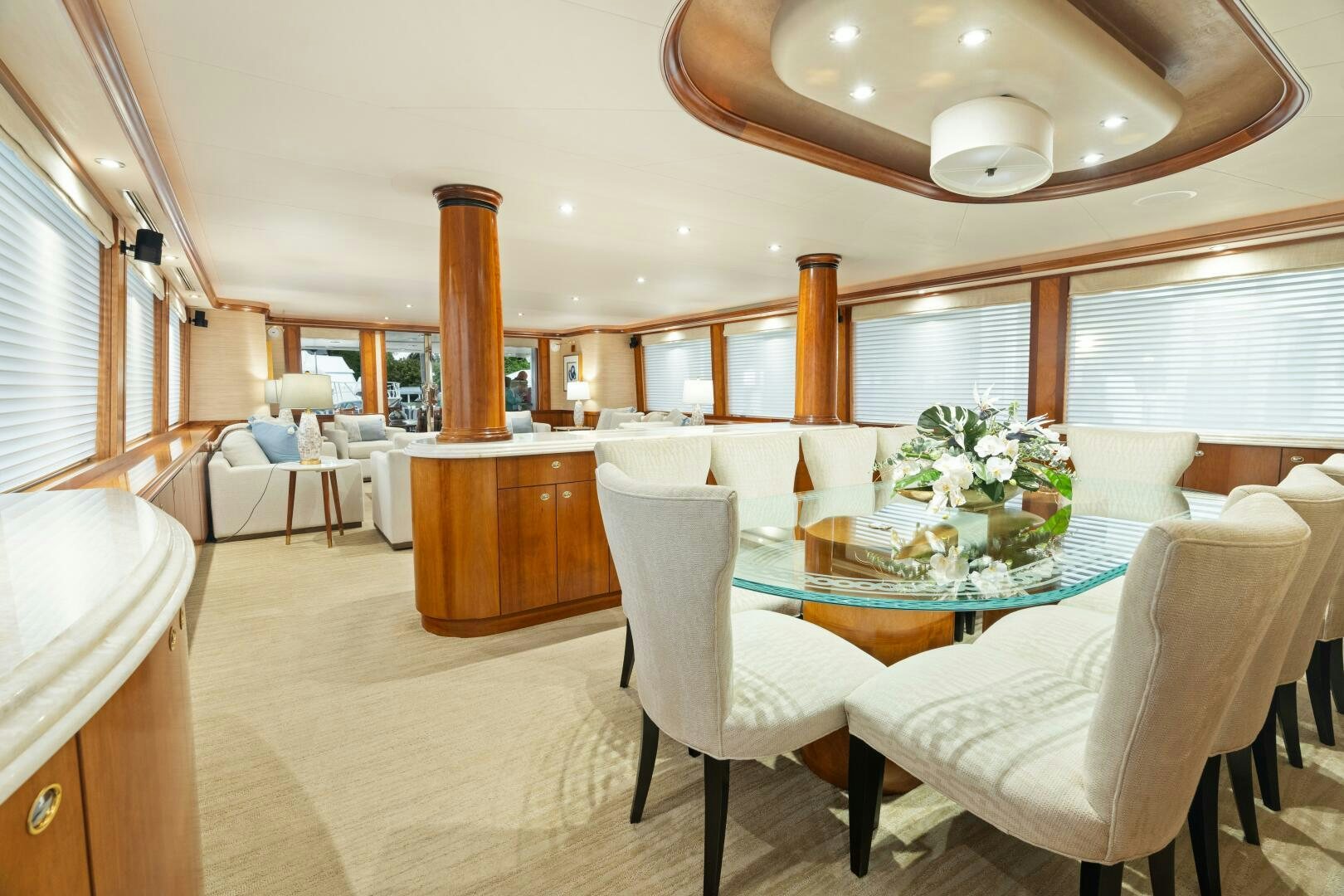 a large dining room with a large table and chairs aboard ELYSIAN Yacht for Sale