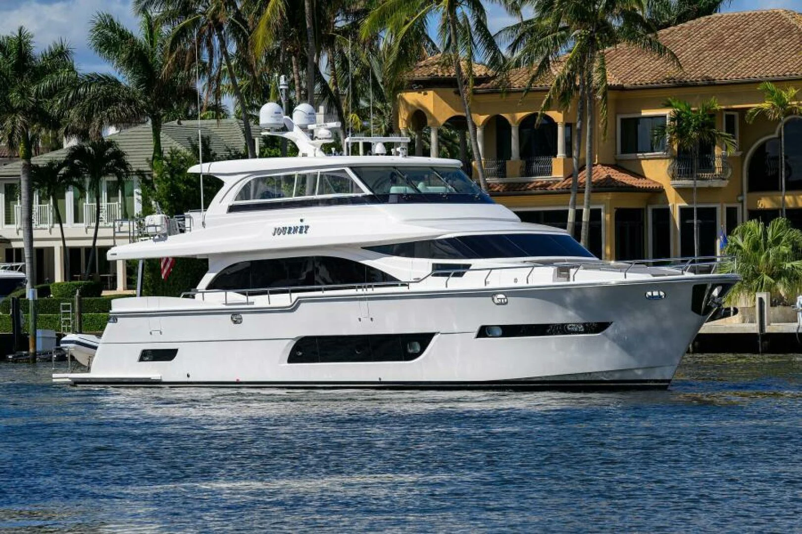 a white yacht in the water aboard JOURNEY Yacht for Sale