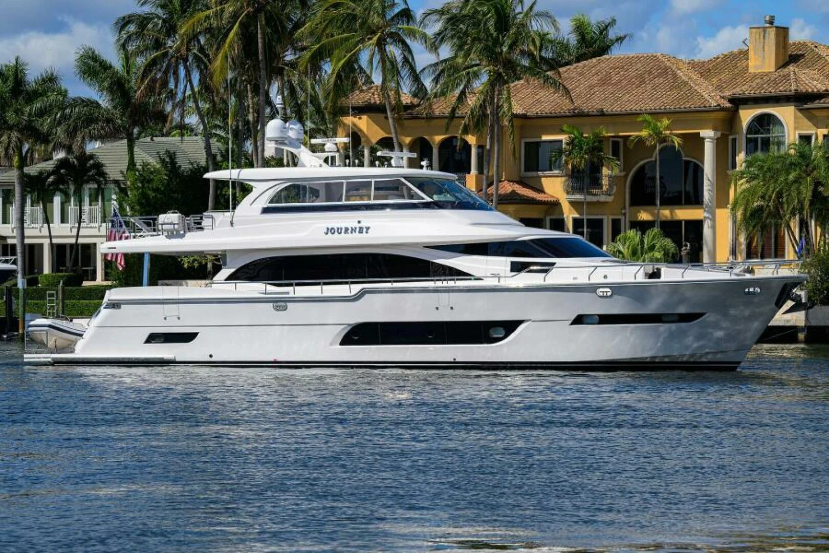 a white yacht in the water aboard JOURNEY Yacht for Sale