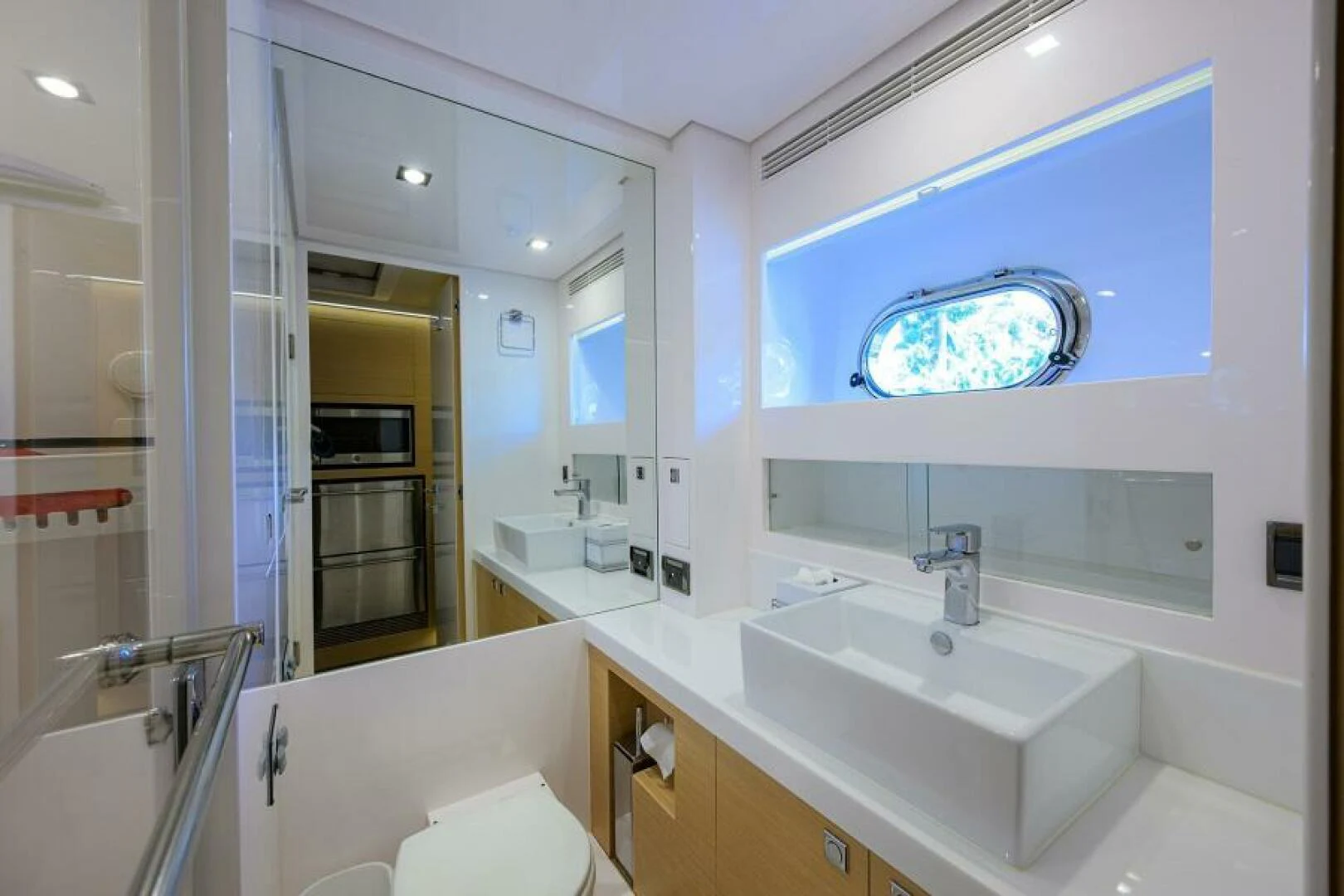 a bathroom with a sink and a mirror aboard JOURNEY Yacht for Sale