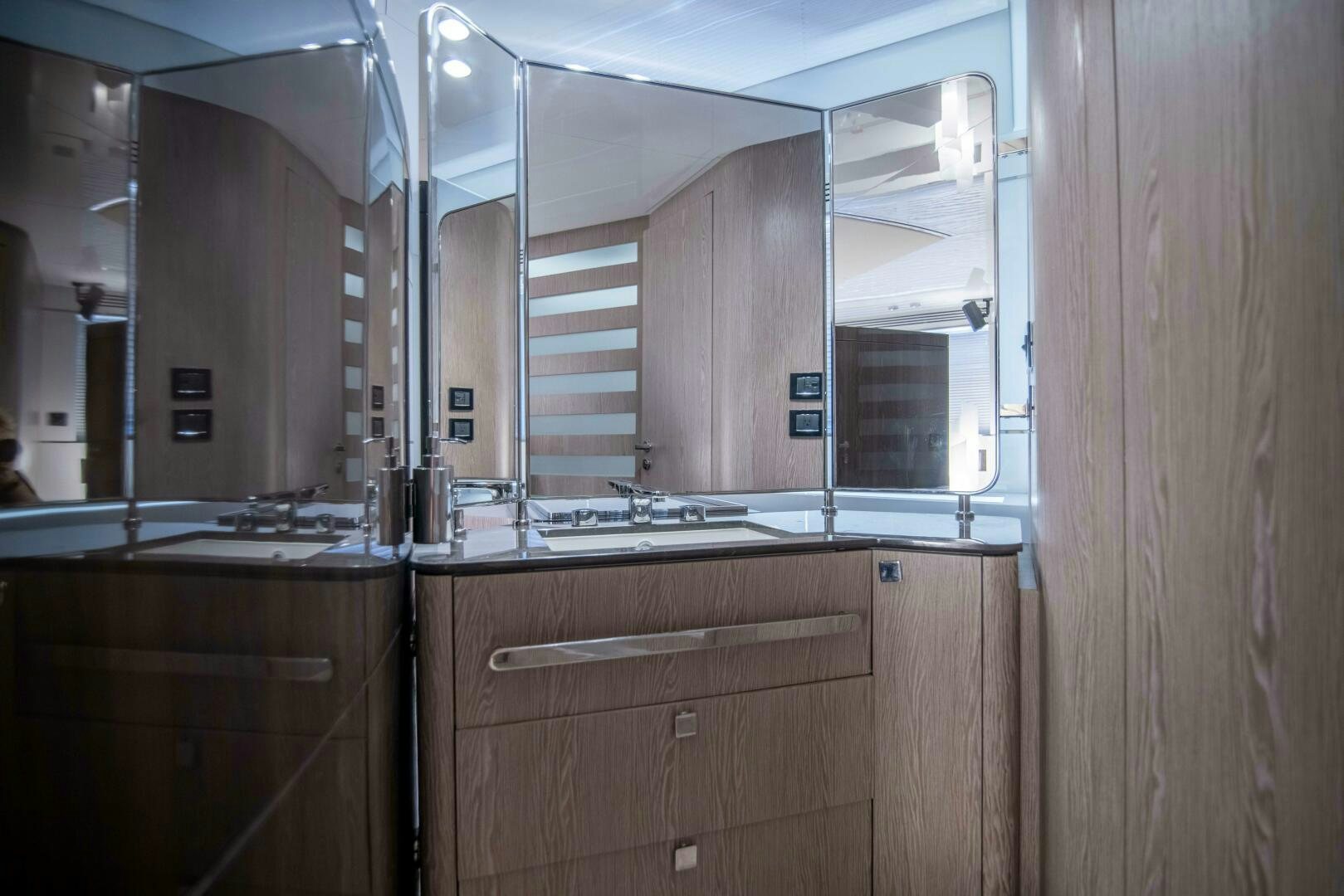 a kitchen with a sink and cabinets aboard TRIPLE PLAY Yacht for Sale